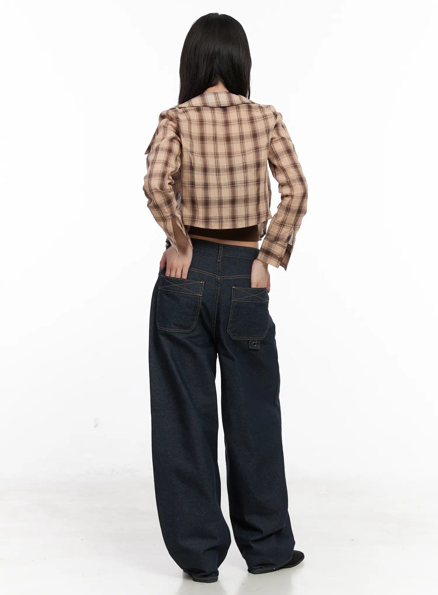 Heaven Wide-Leg Dark Washed Jeans CN513 in dark blue, back full-length view on model, showing large patch pockets with cross stitch detail and rivet hardware, worn with plaid crop shirt.