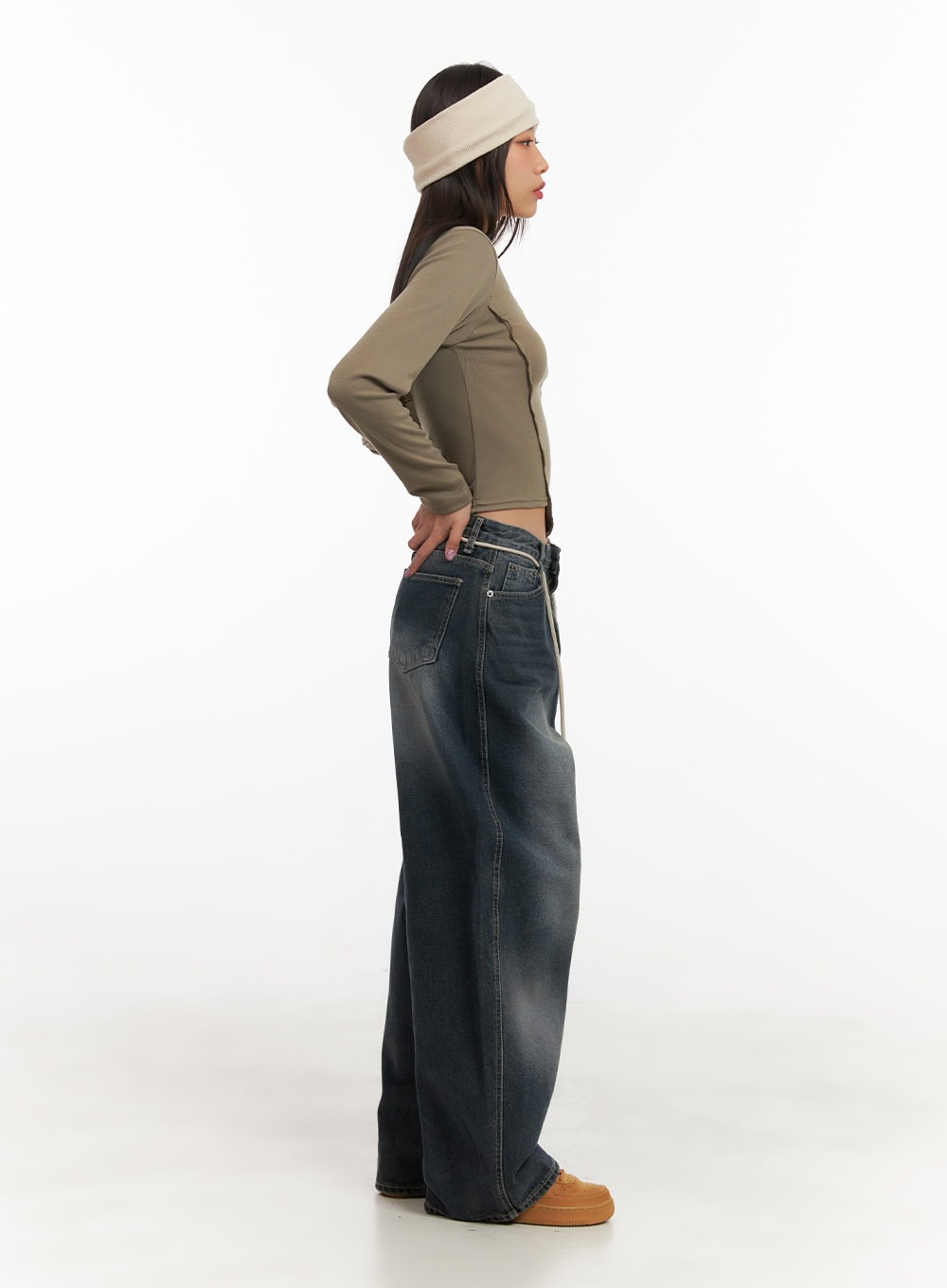 Vivian Washed Cotton Baggy Jeans CD409 in dark blue, full-body side profile on model, acubi street style with olive crop top and headband, exaggerated wide-leg silhouette visible.