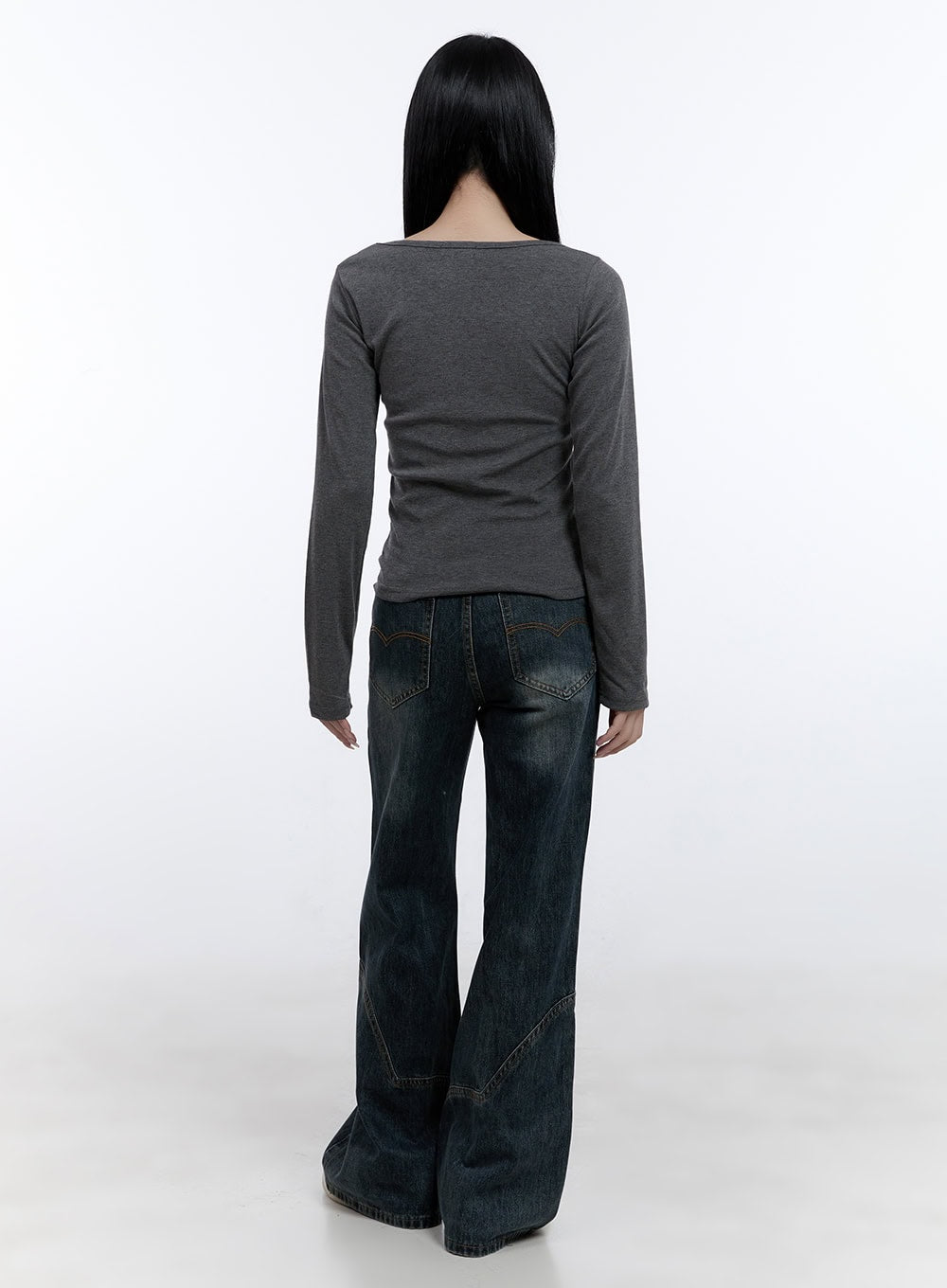 Barbara Washed Wide Leg Jeans CD420 in blue, full-length back shot on model, wide leg washed denim with contrast stitch panels at hem, back pocket stitching visible, styled with grey long sleeve top and white sneakers.