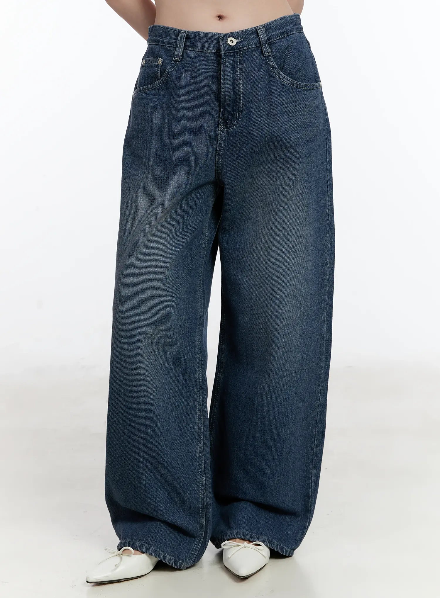 Della Casual Denim Wide Jeans ID511 in blue, front mid-shot on model, washed cotton wide-fit denim, front pockets and button closure visible, long length pooling at white ballet flats.