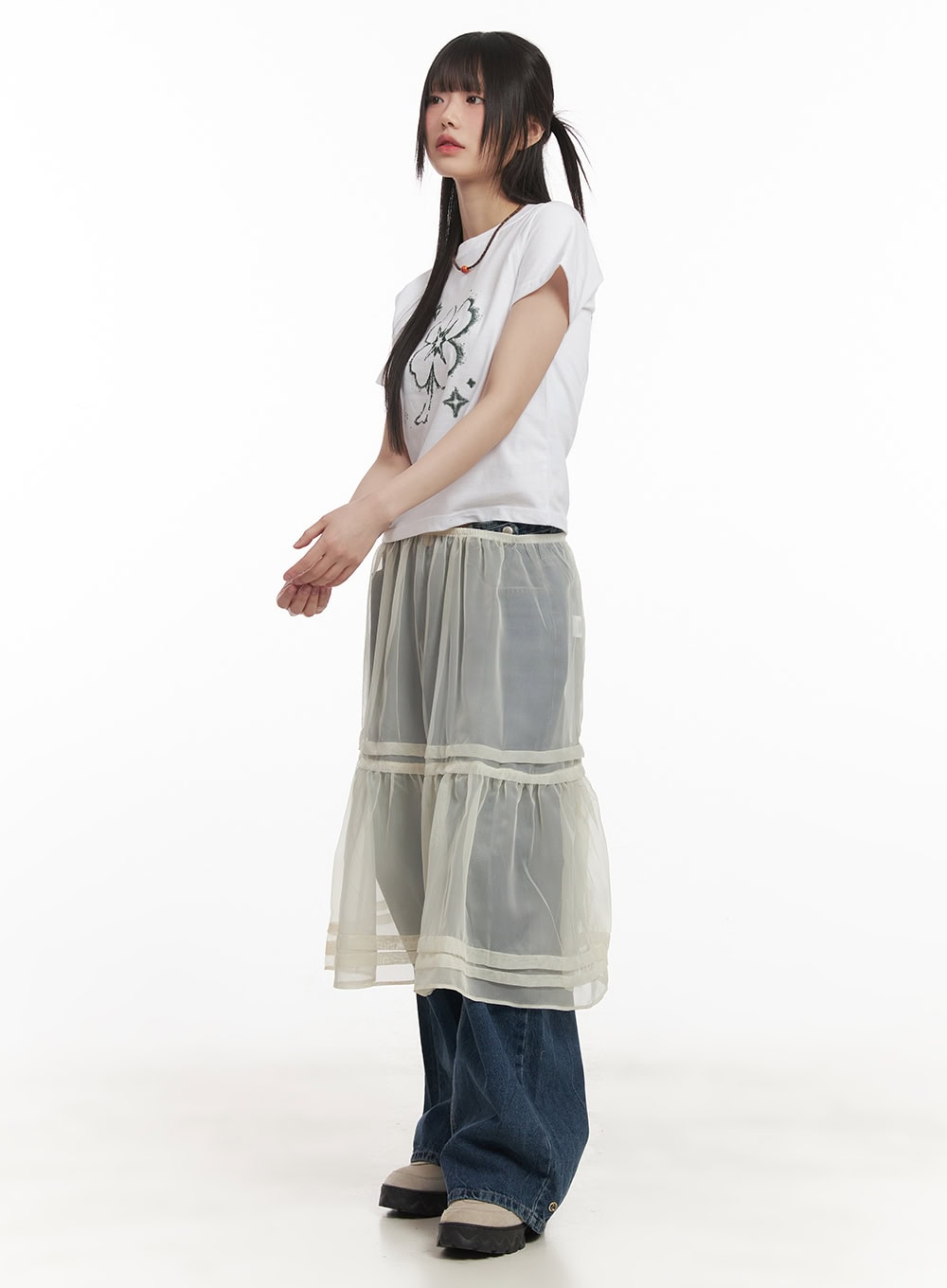 Bri Oversized Buttoned Baggy Jeans CF518 in dark blue, side full-length on model, layered under sheer tiered organza skirt, wide baggy leg visible at hem, chunky sandals.