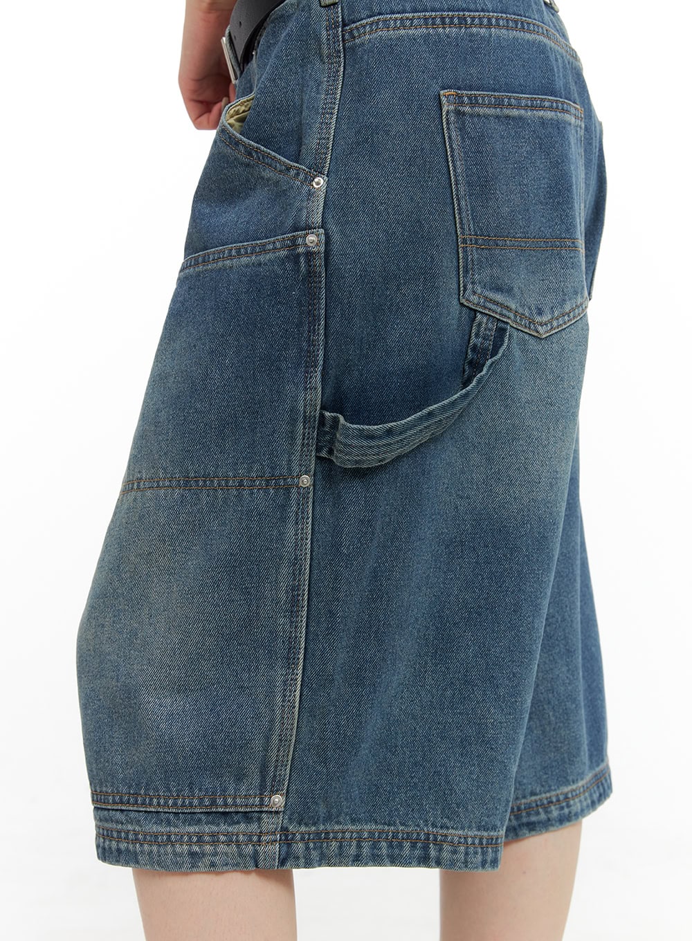 Stud Washed Baggy Jorts (UNISEX) CG408 in blue, close-up back-side detail showing rear patch pocket, stud rivets, carpenter loop, and faded washed denim finish.