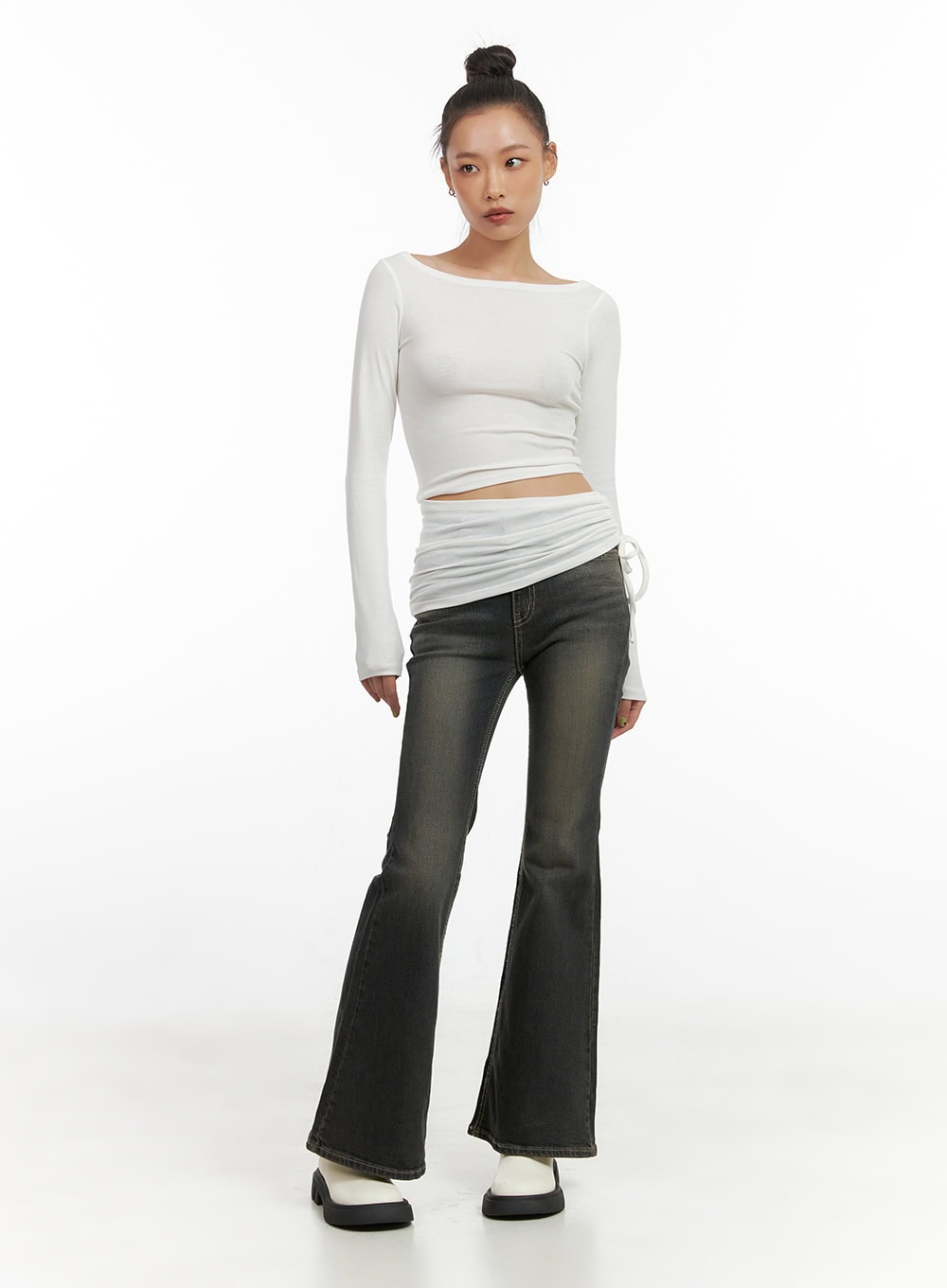 Paisley Slim-Fit Bootcut Washed Jeans CO424 in dark blue, full-length front view on model, slim fit through thigh flaring to bootcut hem, washed finish, styled with white ruched crop top.