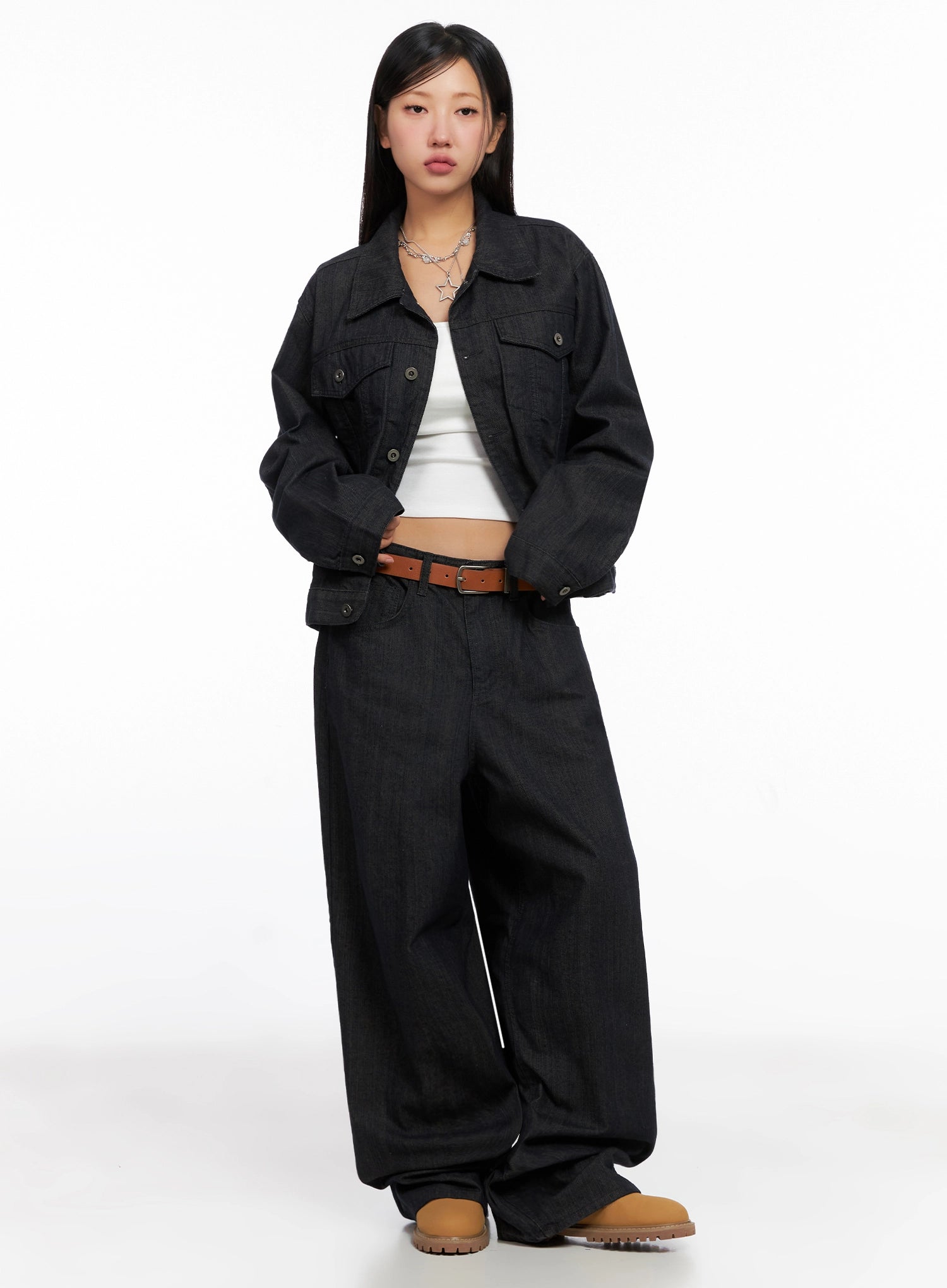 Heidi Wide-Leg Jeans IG527 in dark blue, front full-body on model, paired with dark denim jacket, white crop tank, brown belt, and tan chunky boots, straight-on pose.