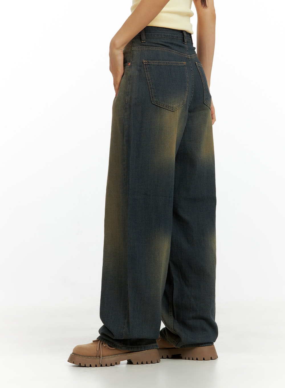 Vintage Washed Denim Baggy Pants CU420 in dark yellow, rear three-quarter close-up on model, highlighting back pocket detail, yellow fading wash, and wide baggy leg.