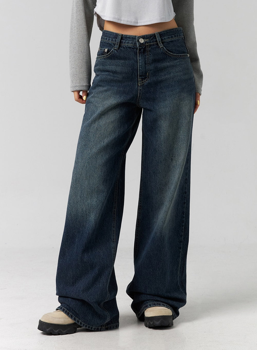 Low Rise Washed Wide Jeans CG315 in dark blue, front mid-shot from waist to ankle, low-rise five-pocket construction, heavily washed wide-leg denim, whiskering detail at thighs.