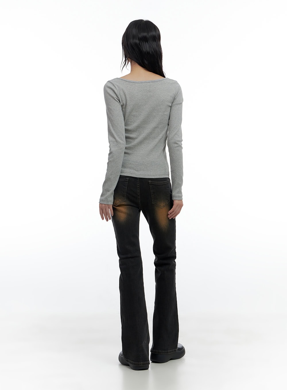 Harley Slim Washed Denim Bootcut Jeans CS420 in Blue, full-body back shot on model, bootcut flare silhouette, amber washed fading on back panels, paired with fitted grey long-sleeve top.
