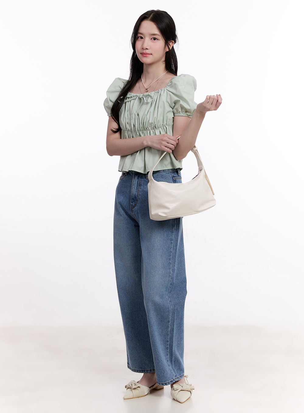 Jamie Comfy Straight-Fit Jeans CM526 in mid-blue wash, three-quarter front view on model, relaxed straight-fit washed denim, paired with mint ruched puff-sleeve top and cream hobo bag.