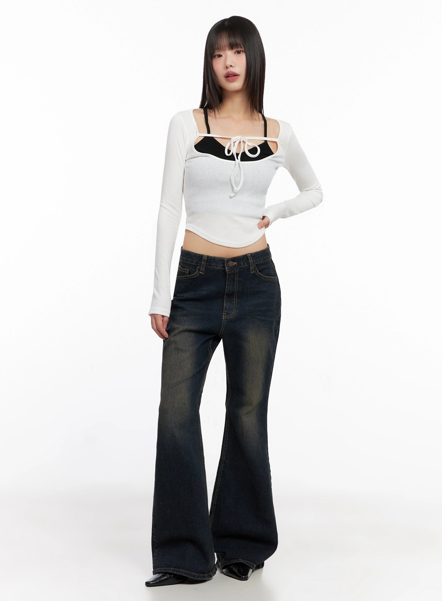 Lyanna Vintage Wash Bootcut Jeans IN503 in dark blue, full-length front shot on model, paired with white tie-front crop top and black cami, showcasing long flared leg.