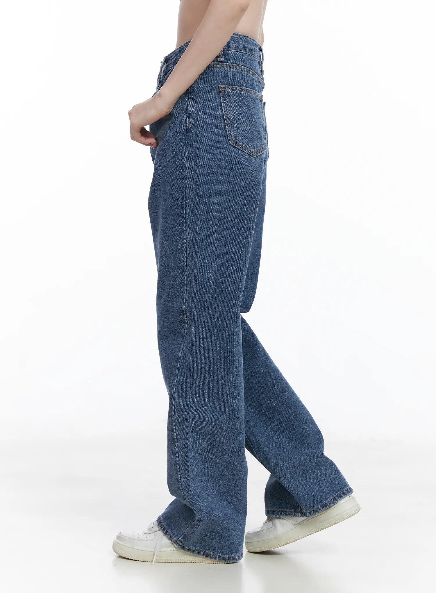 Ashlyn High-Waist Fleece-Lined Wide-Leg Jeans CJ507 in blue, side close-up on model, highlighting high waist, back pocket placement, and wide straight leg, worn with white sneakers.