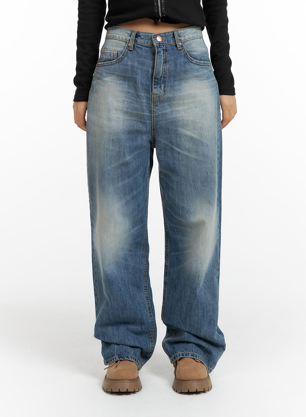 Wide Washed Denim Jeans CF419 in blue, front cropped view on model, wide-fit washed cotton denim with faded thigh detail and five-pocket construction, tan boots.