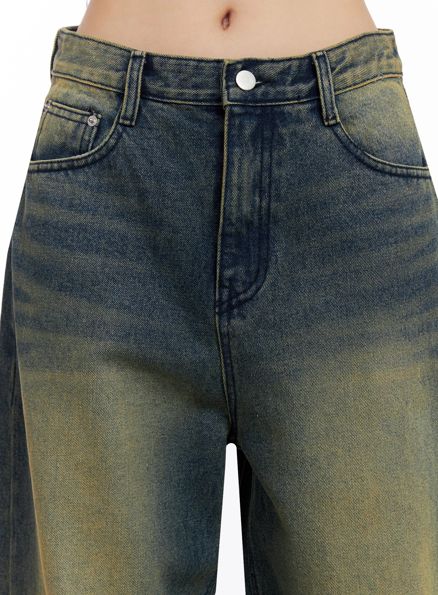 Elora Washed Baggy Jeans IS525 in dark blue, close-up detail of waistband and front pockets, yellow-green washed cotton denim showing silver button, belt loops, and coin pocket.
