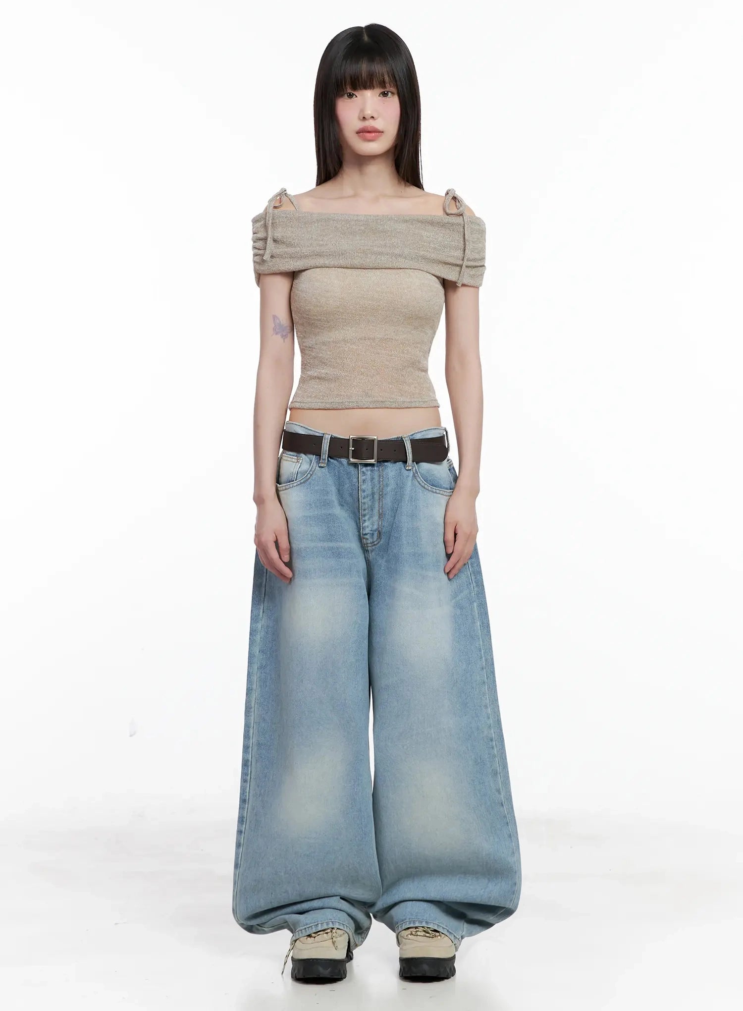 Dain Washed Wide-Leg Jeans IL531 in light blue, full-body front shot on model standing straight, paired with beige off-shoulder knit crop and leather belt, chunky boots.