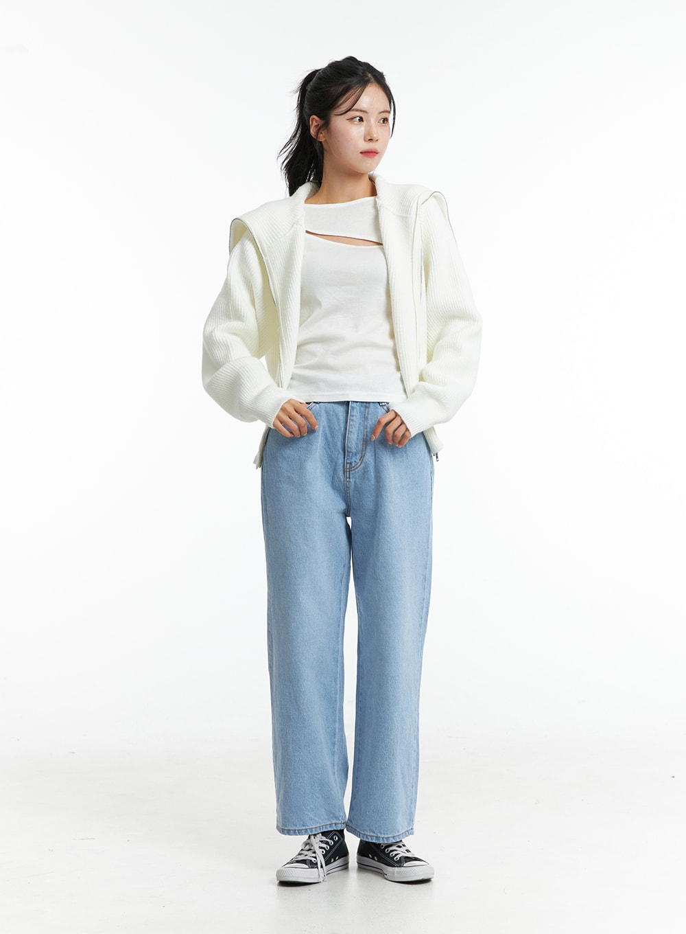 Light Washed Straight Jeans ON329 in light blue, full-body front shot on model with hands in pockets, casual straight fit, layered under cream ribbed cardigan and white tank.