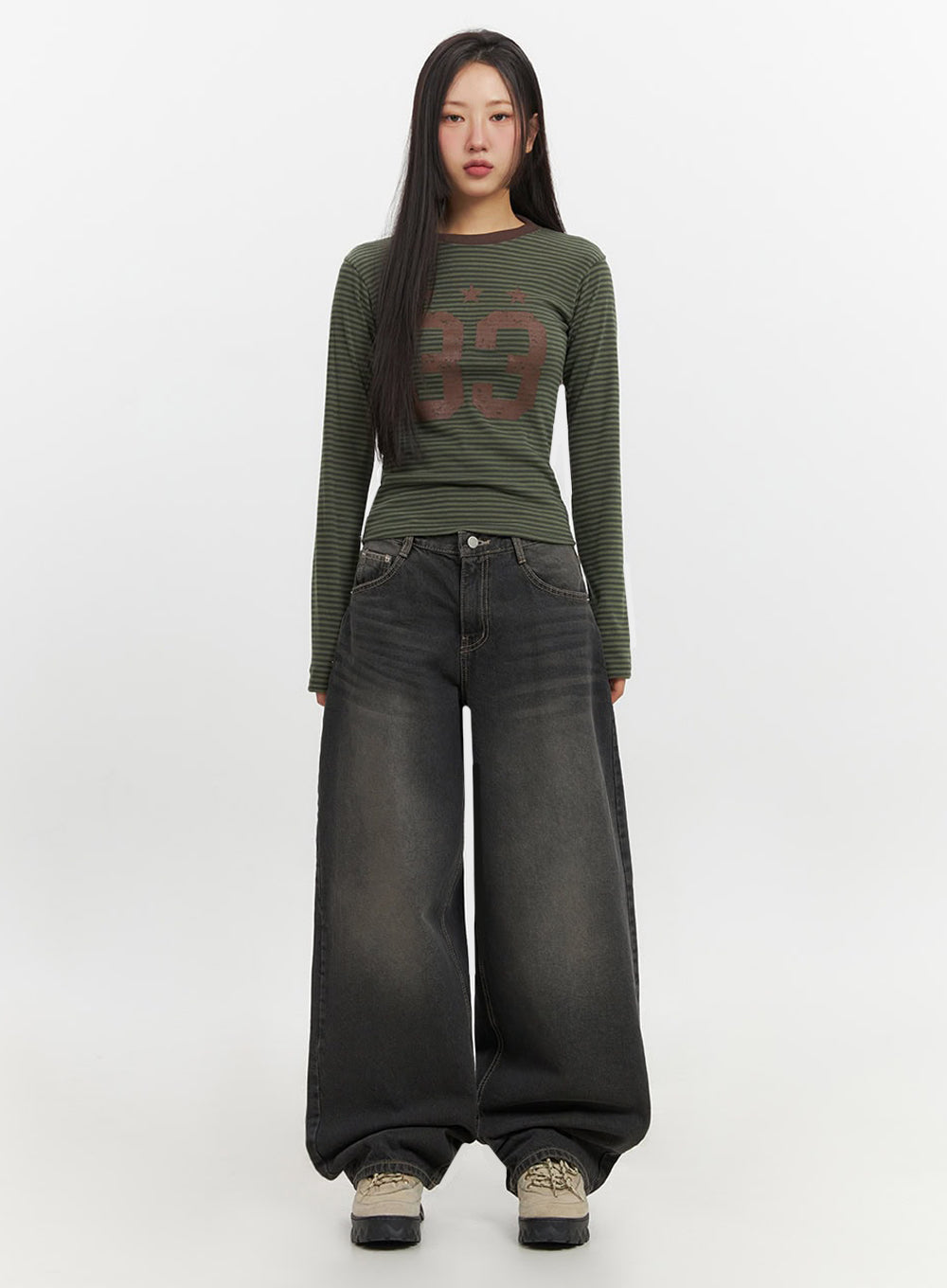 Skyla Washed Wide-Leg Baggy Jeans IF511 in washed black, front full-length shot on model without hat, relaxed arms at sides, exaggerated wide-leg pooling at hem, paired with striped crop top.