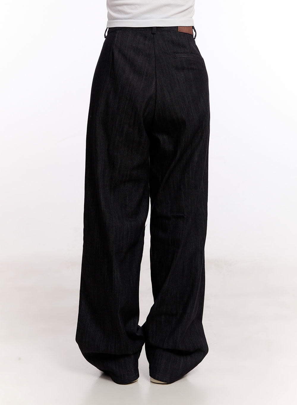 Pintuck Wide-Leg Denim Pants CM527 in black, back view on model, showing rear pocket, leather brand patch tab, and voluminous wide-leg denim silhouette.