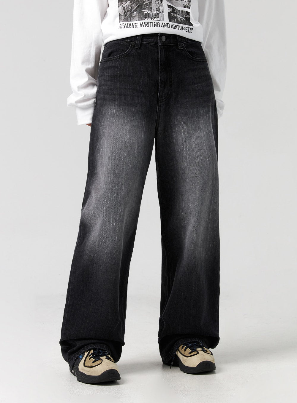 Washed Wide-Leg Jeans CG327 in black, front waist-to-hem close-up on model, high-rise fit with button fly, faded washed denim texture visible across wide leg, styled with white top.