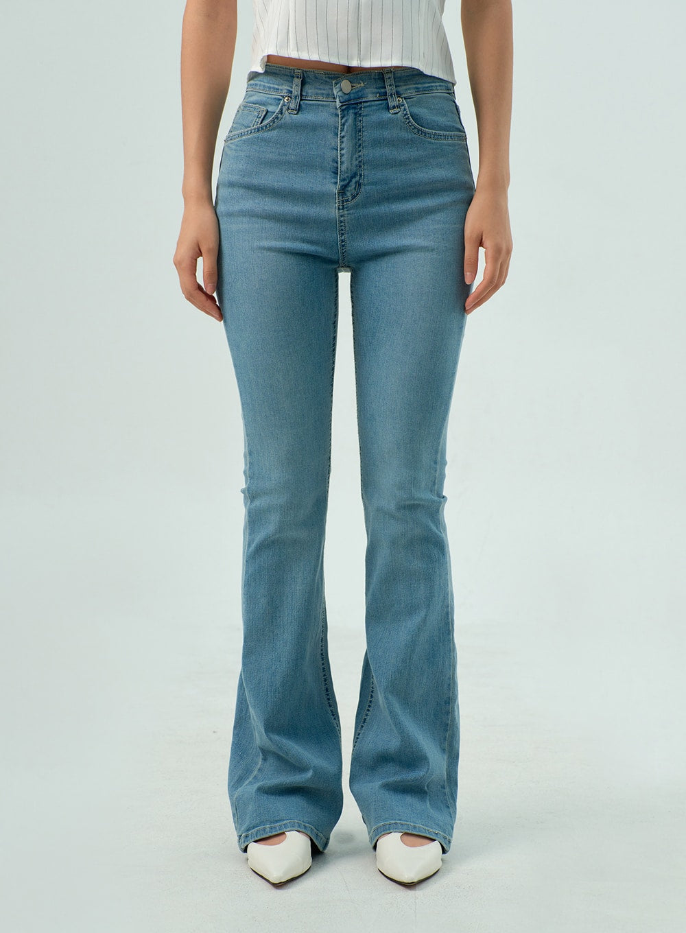Light Wash Bootcut Jeans CY330 in light blue, front close-up waist-to-hem on model, high-rise 5-pocket construction, button fly, slim fit through hip flaring into bootcut at ankle.