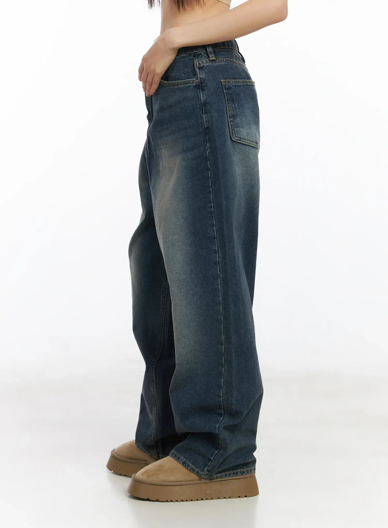 Eliza Fleece-Lined Washed Wide Leg Jeans CD518 in blue, side close-up on model, showing side pocket detail and washed fading gradient on wide-leg cotton denim, tan boots.