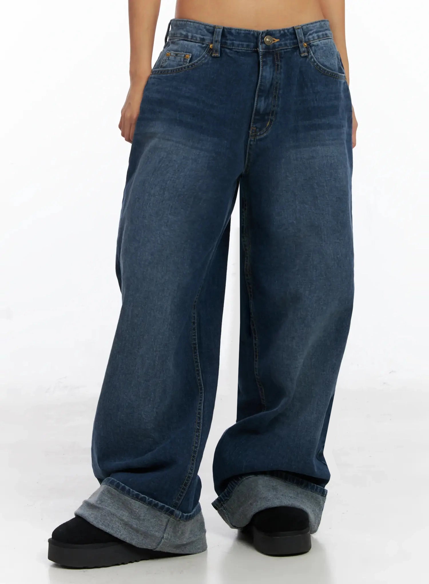 Anahi Baggy Jeans IN528 in blue, cropped front shot on model from waist to ankle, highlighting ultra-wide leg silhouette and contrast grey roll-up cuff hem.