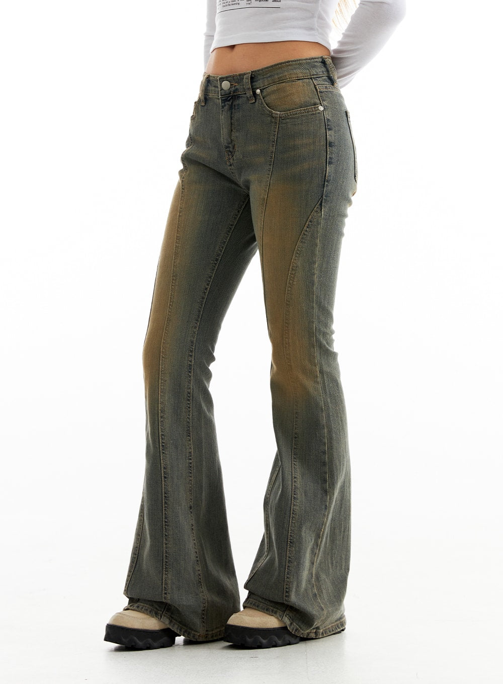 Stitched Bootcut Jeans CO313 in Blue, side-angle close-up from hip to hem on model, showcasing curved stitch seams, low waist, and wide flared hem with washed finish.