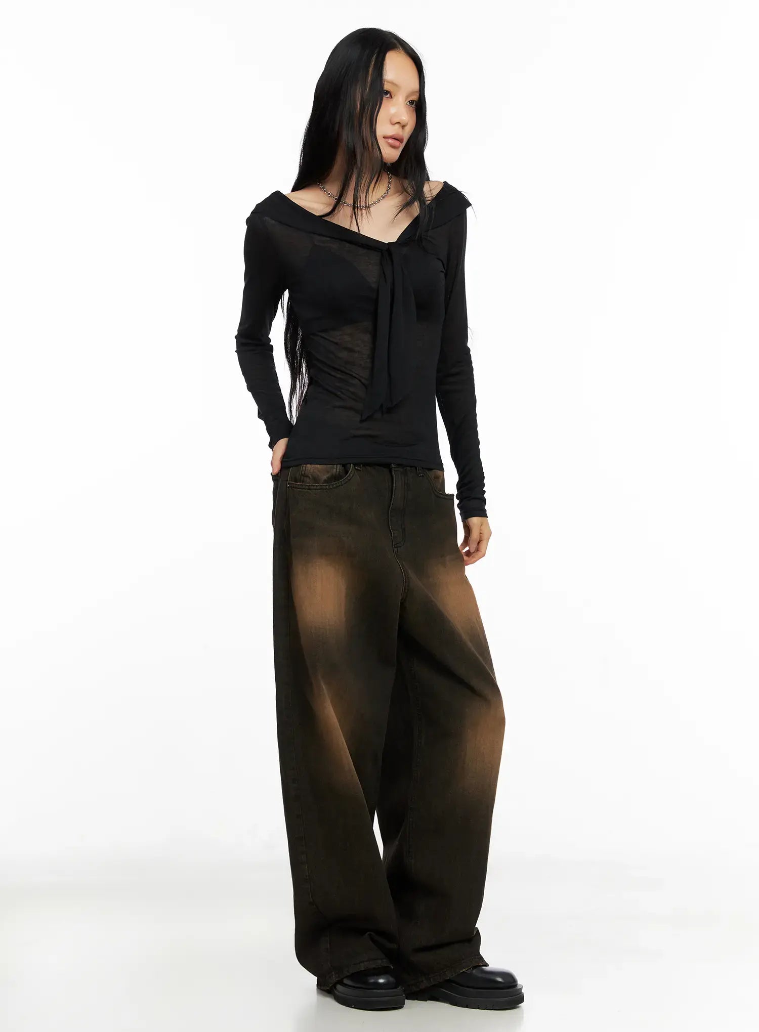 Analia Washed Wide-Leg Jeans CO529 in brown, diagonal full-body shot on model, paired with black sheer off-shoulder tie top, wide cotton denim with brown wash gradient.