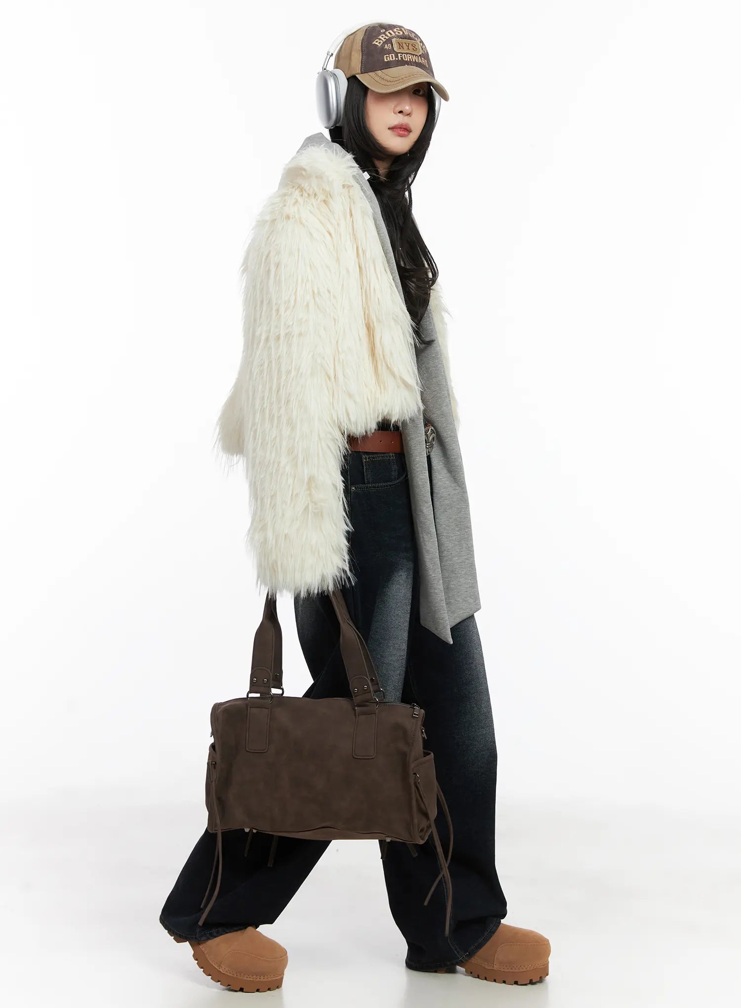 Soph Fleece-Lined Washed Wide-Leg Jeans CD509 in dark washed indigo, three-quarter side walking shot on model, paired with cream faux-fur coat, grey hoodie, and brown tote bag.
