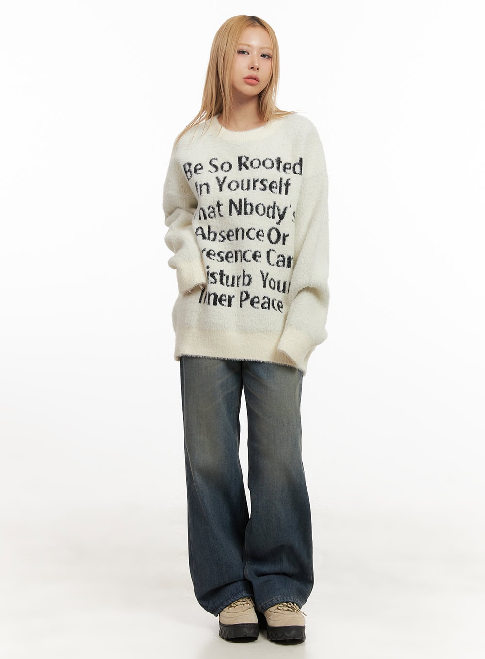 Michelle Washed Wide-Leg Jeans CJ508 in blue, full-body front shot on model, wide-fit washed denim with yellow-toned fading, styled with oversized cream graphic sweater and chunky sneakers.