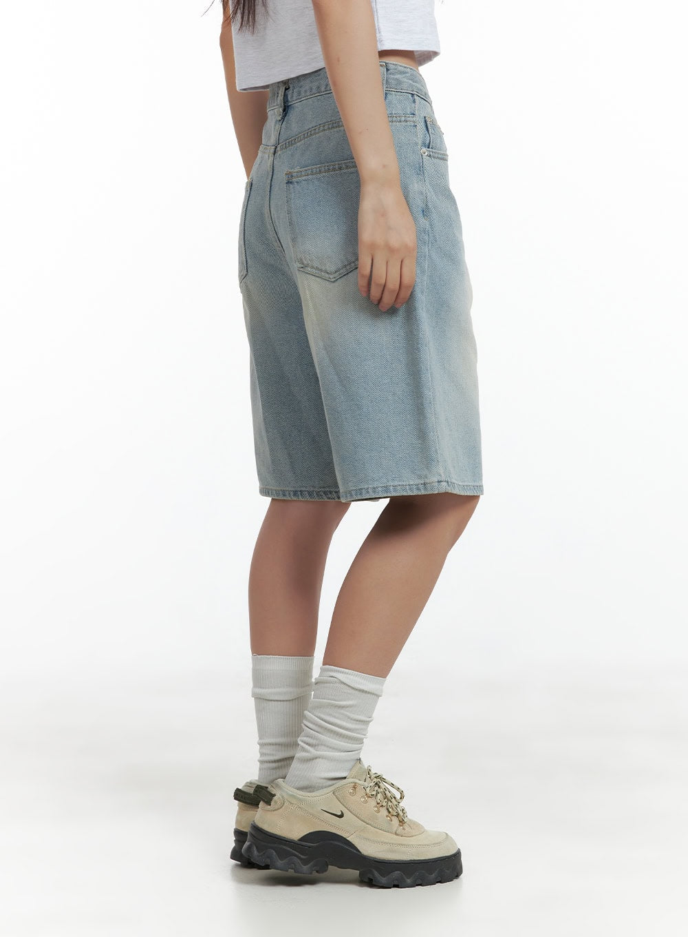 Light Washed Jorts CL417 in light blue, rear three-quarter waist-down shot on model, wide-fit washed denim shorts showing back pocket detail and sun-faded texture, paired with white socks.