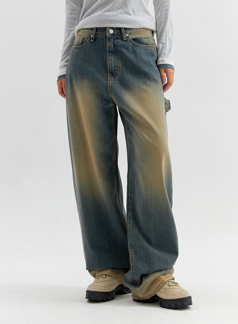 Vintage Wash Wide Leg Jeans CO306 in blue, front mid-shot on model, wide-fit denim with sun-bleached yellow fade across thighs, carpenter pocket detail visible at hip.