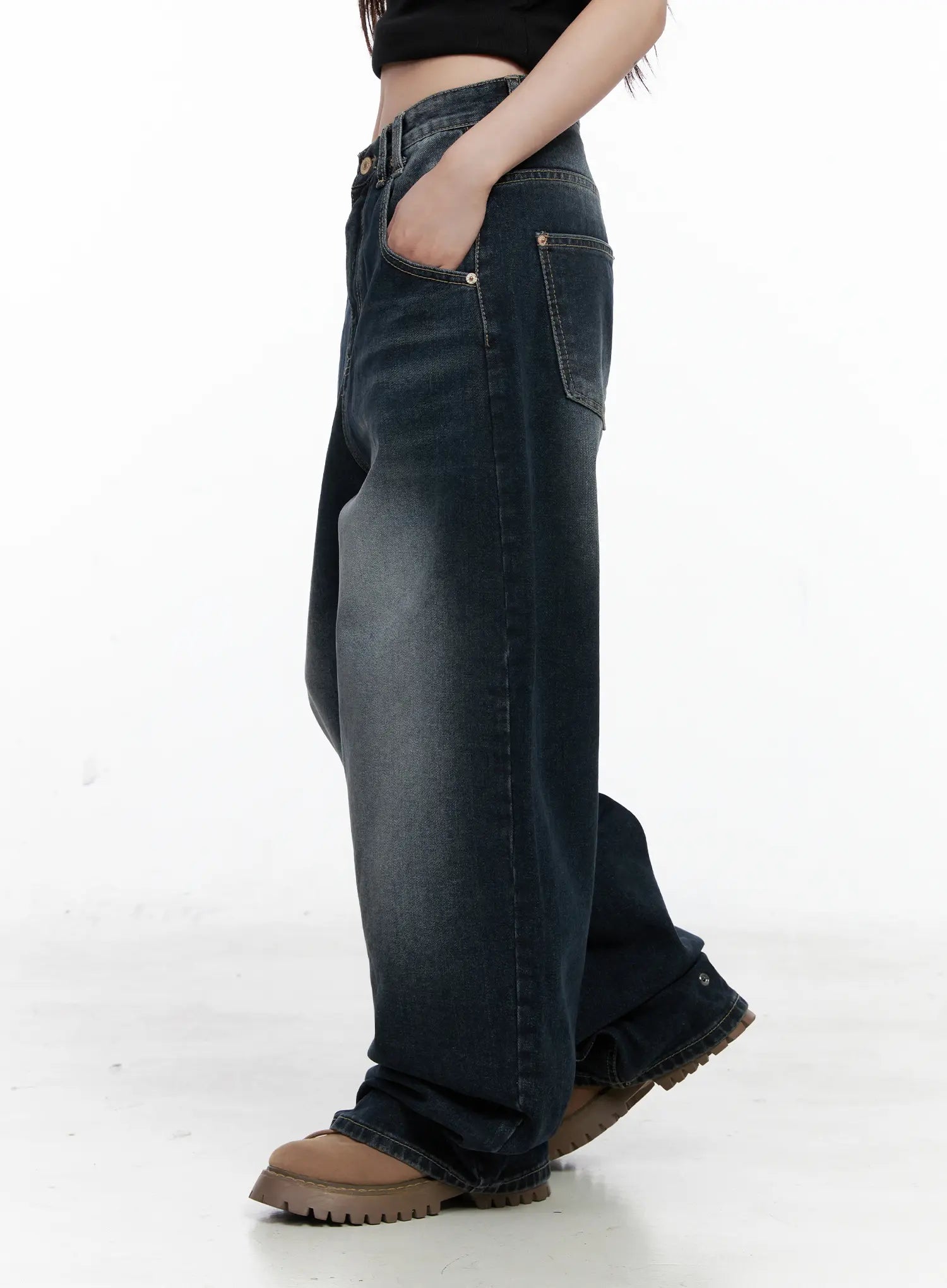 Isla Washed Baggy Jeans CO521 in dark blue, side close-up on model, hand in pocket, highlighting exaggerated wide-leg silhouette, washed gradient, and side pocket detail.
