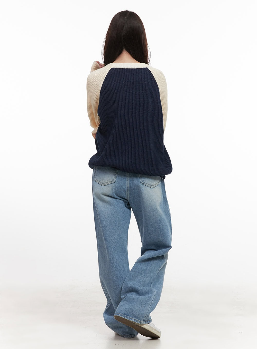Kelly Washed Baggy Jeans CJ514 in light blue, back full-body shot on model, showing back pockets with contrast stitching, wide-leg washed denim, paired with colorblock knit top.