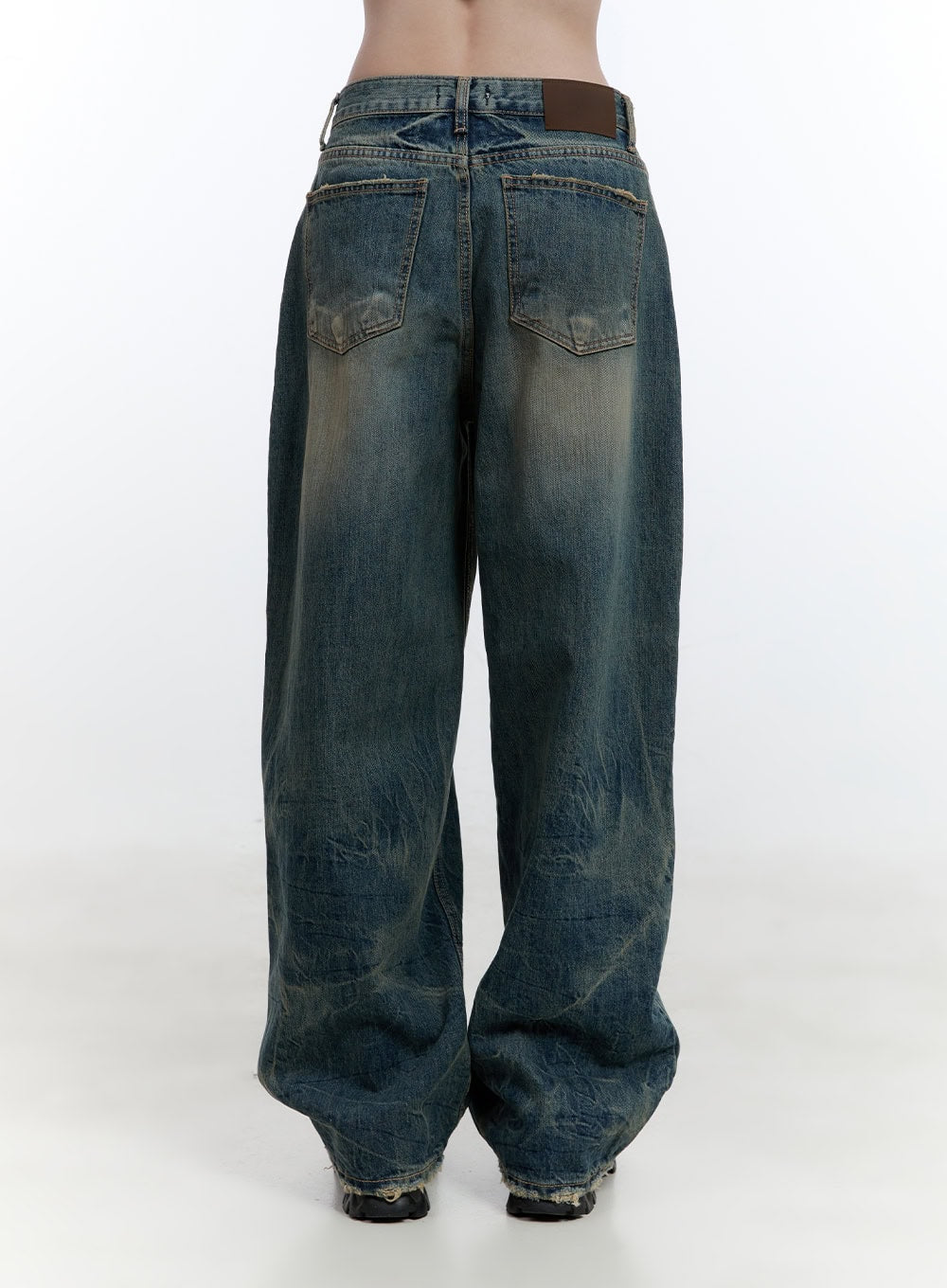 Danielle Vintage Washed Baggy Jeans CJ522 in blue, back product shot, featuring dual back pockets, leather patch waistband label, heavy vintage wash with fading, and frayed hem detail.