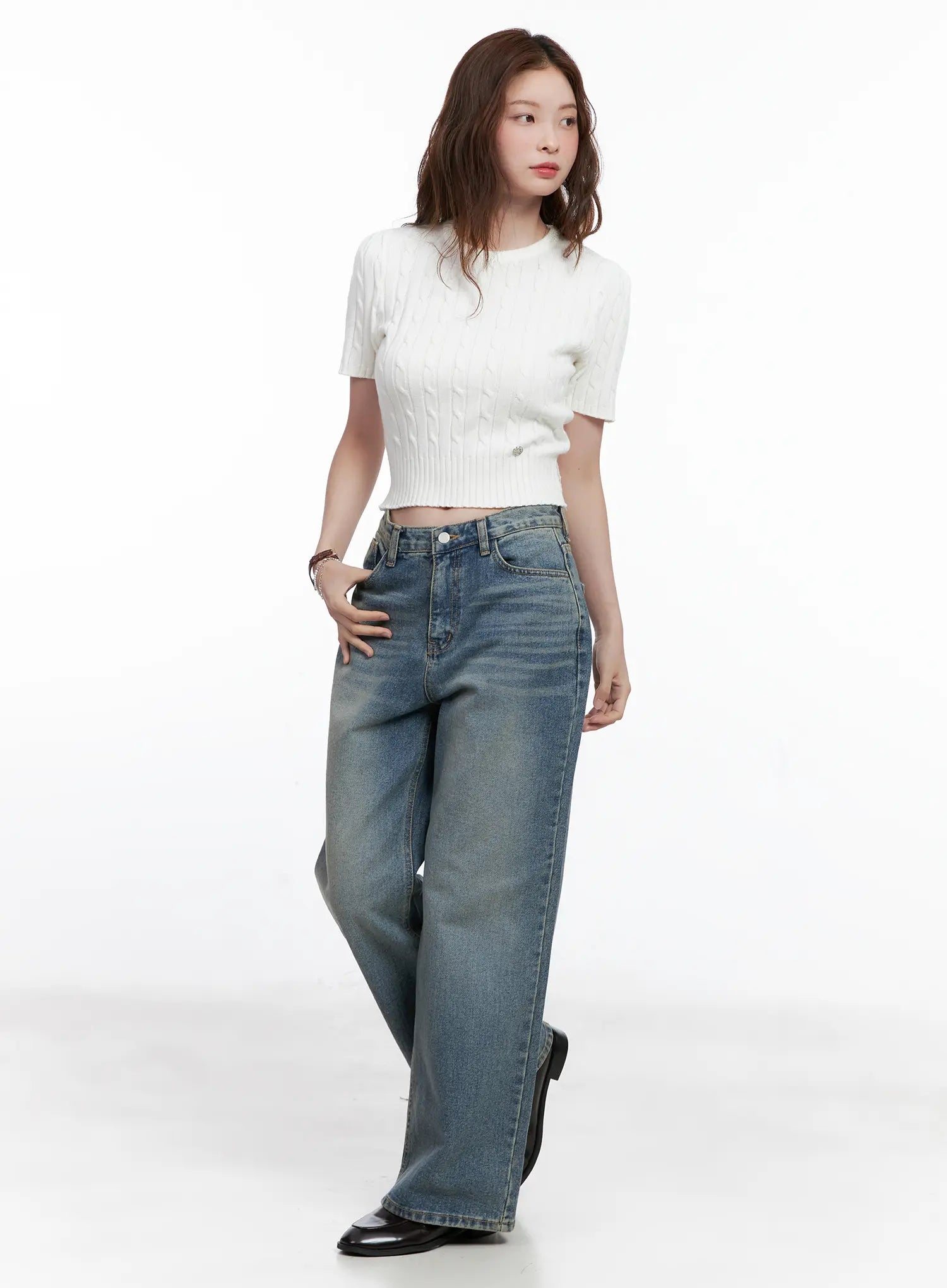 Qu Wide-Leg Vintage Wash Jeans CG521 in blue, full-length side-angled shot on model, styled with white cable-knit crop top and black loafers, regular-length wide fit with casual styling.