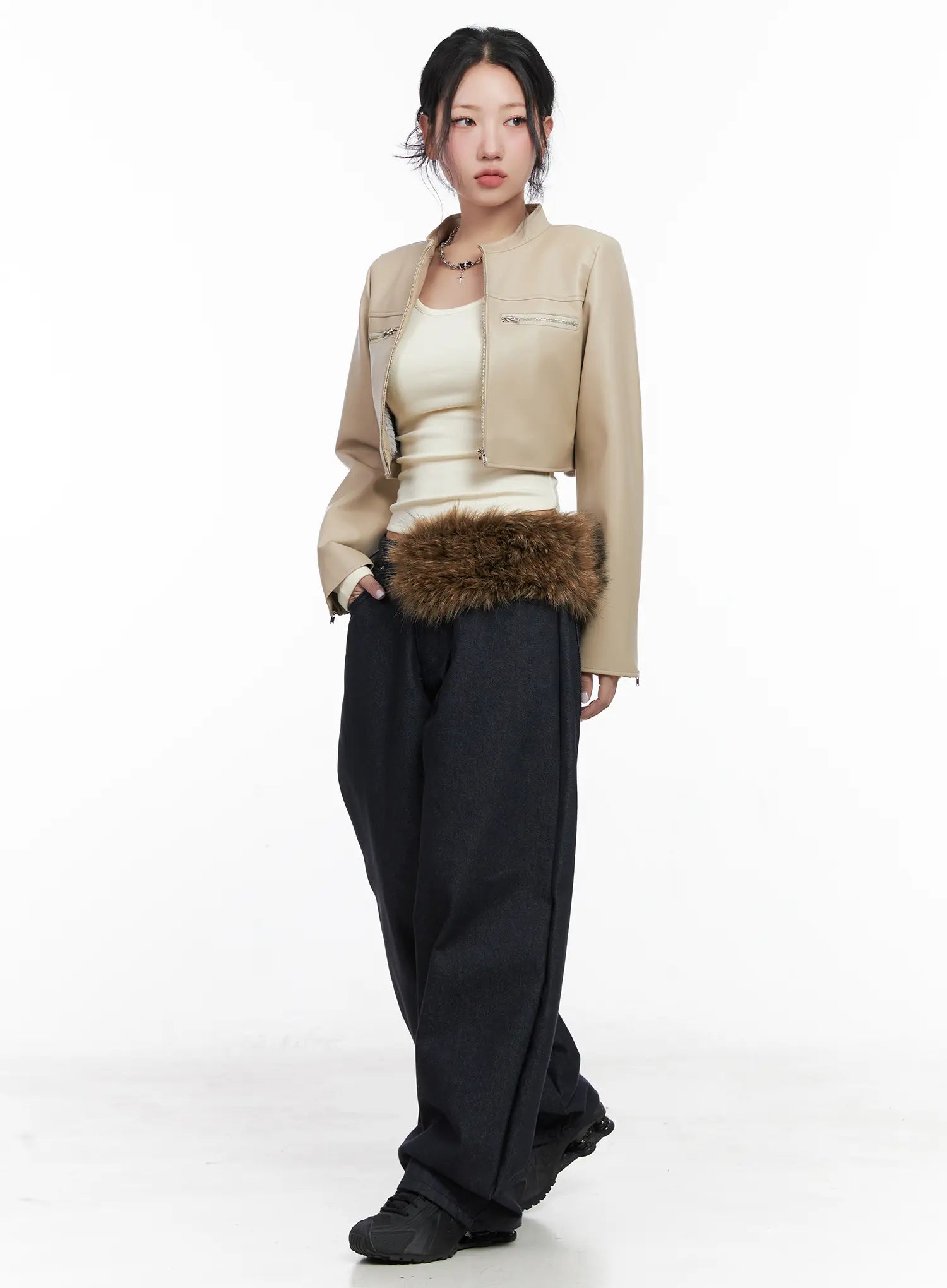 Solana Unwashed Wide-Leg Jeans CN514 in dark indigo, three-quarter front on model, floor-grazing wide leg, styled with beige faux-leather cropped jacket and brown fur waist bag.