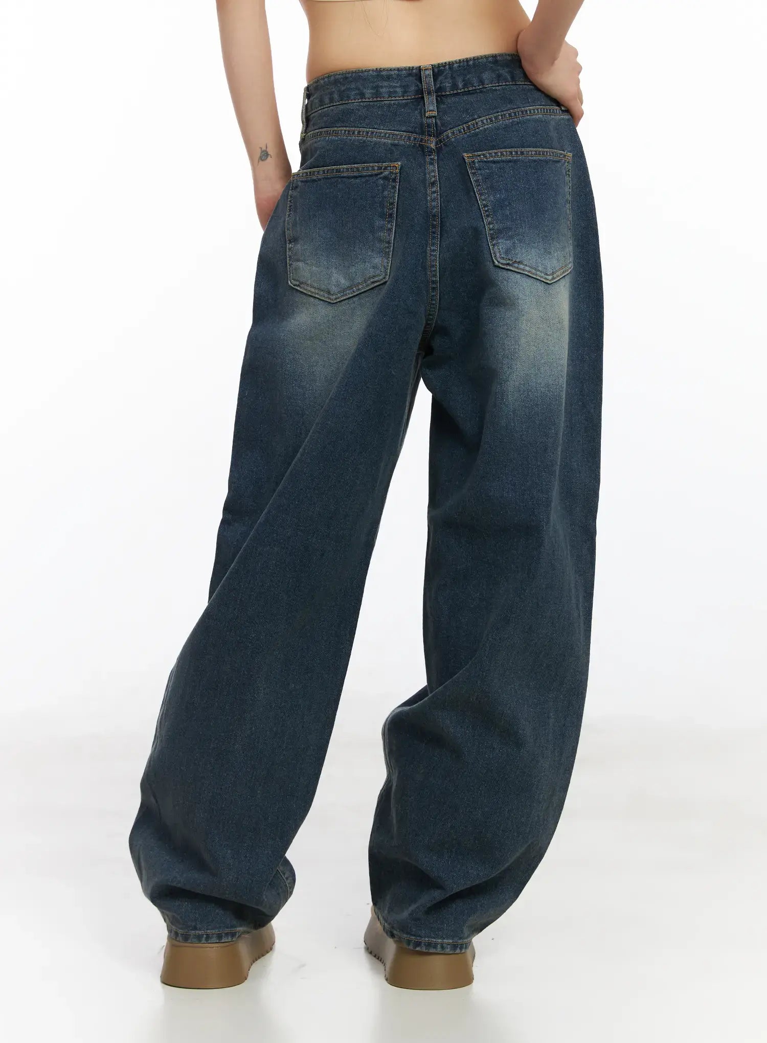 Eliza Fleece-Lined Washed Wide Leg Jeans CD518 in blue, back view crop on model, dual back pockets with contrast stitching, washed wide-leg denim with subtle whisker fading.