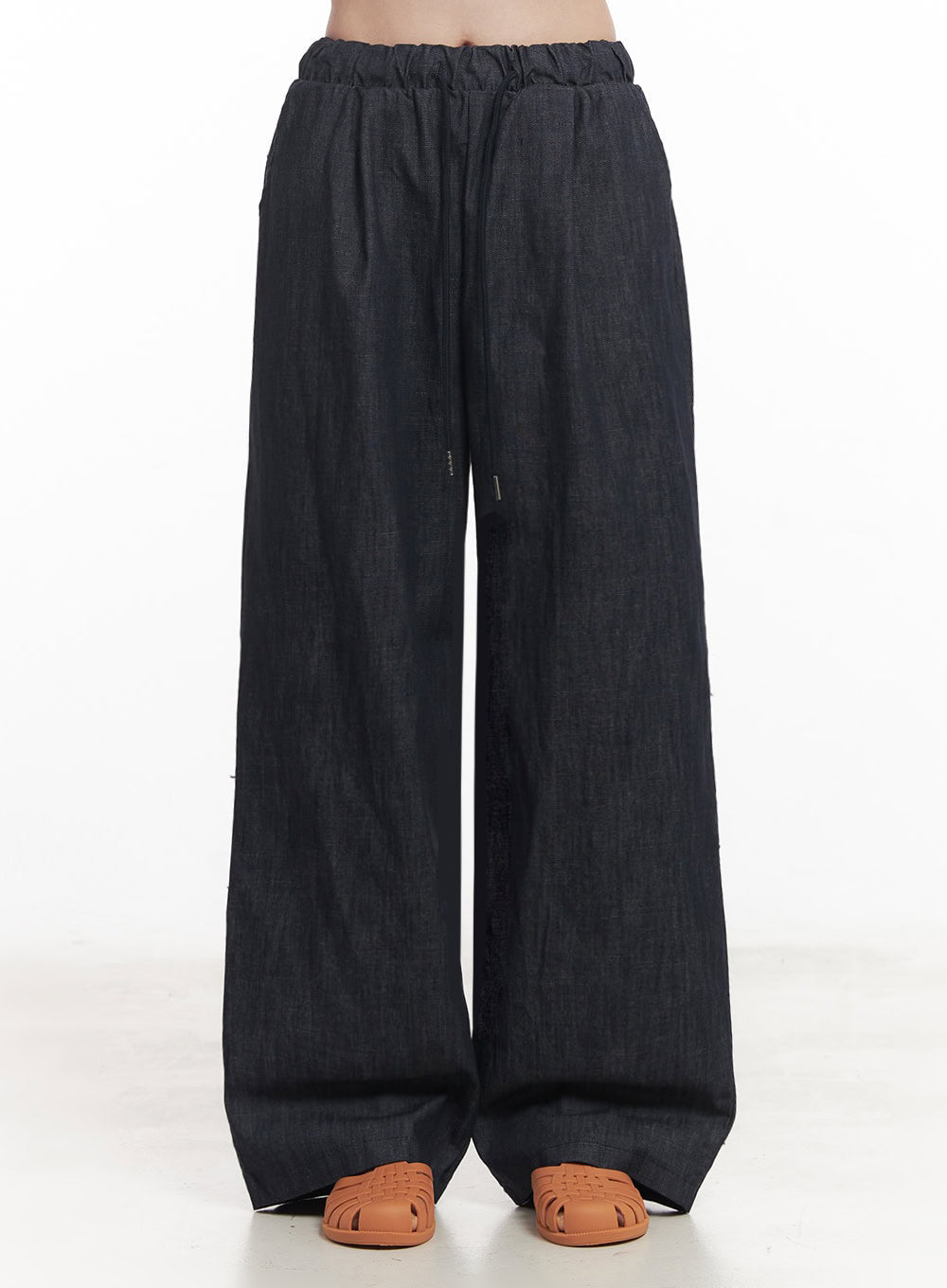 Cotton Denim Wide-Leg Pants IY509 in dark navy, front waist-to-hem crop shot on model, highlighting wide-leg silhouette, banded drawstring waist, and full-length cotton denim drape over tan sandals.