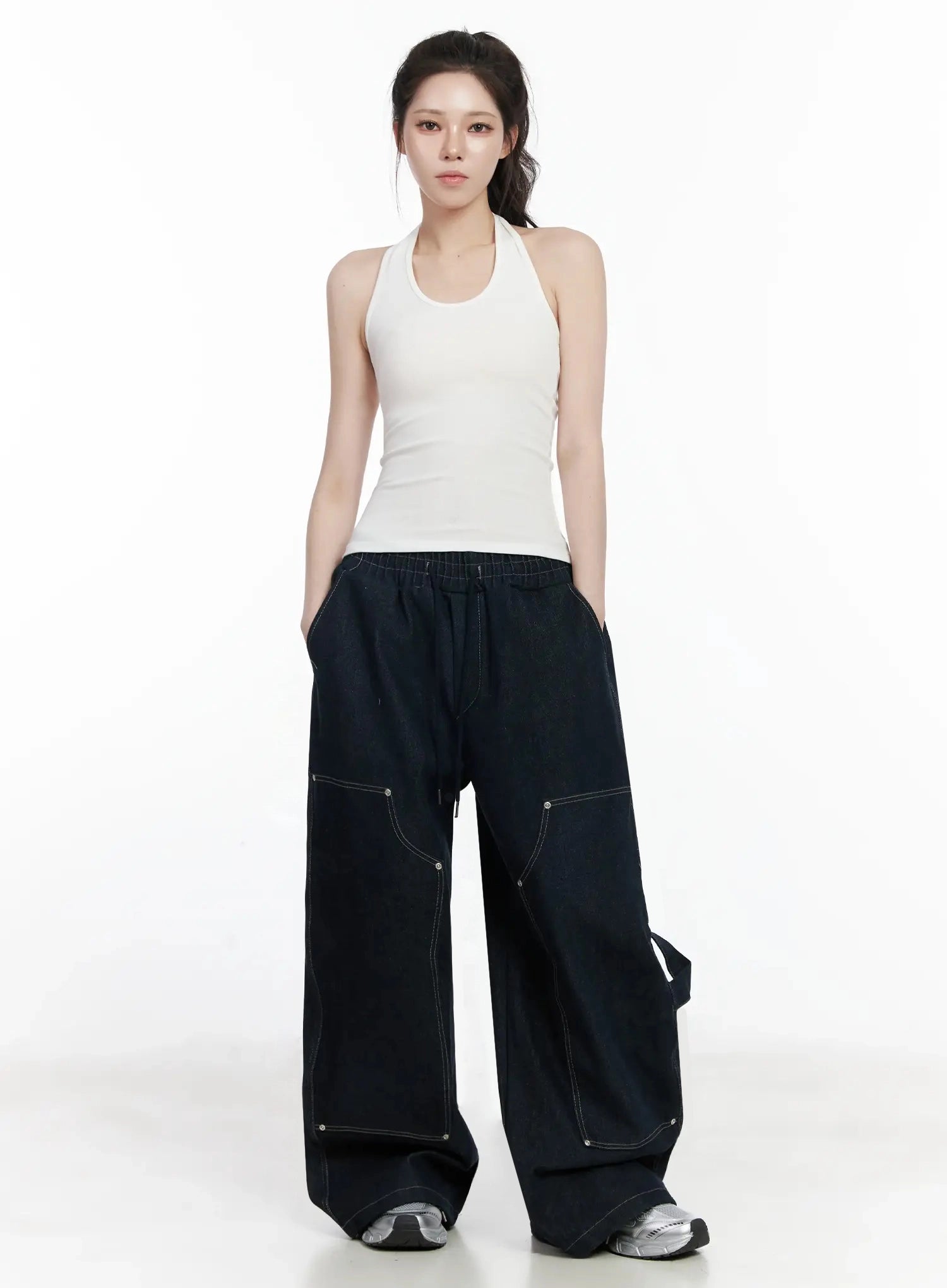 Ashlyn Carpenter Wide-Leg Jeans IJ528 in dark blue, full-length front shot on model, styled with white halter top, contrast stitching and side strap detail visible, long wide-leg silhouette.