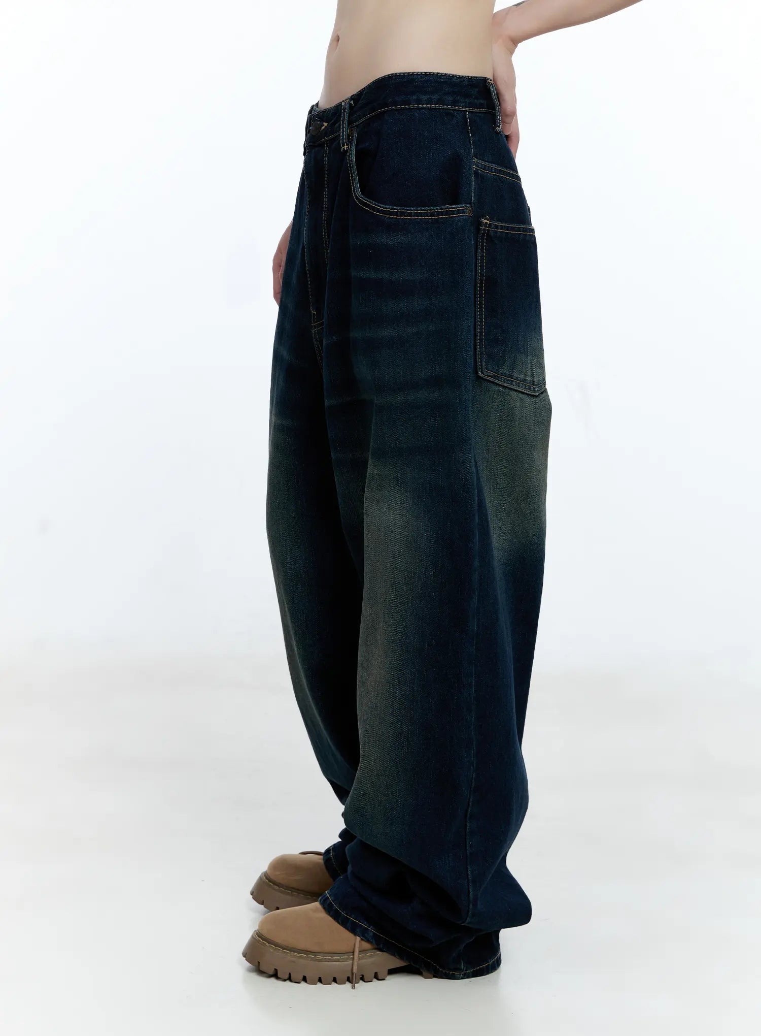 Jinnie Washed Wide-Leg Jeans CG511 in dark blue, close-up side shot on model showing side pocket detail, washed fading, contrast topstitching, and voluminous wide-leg drape to hem.