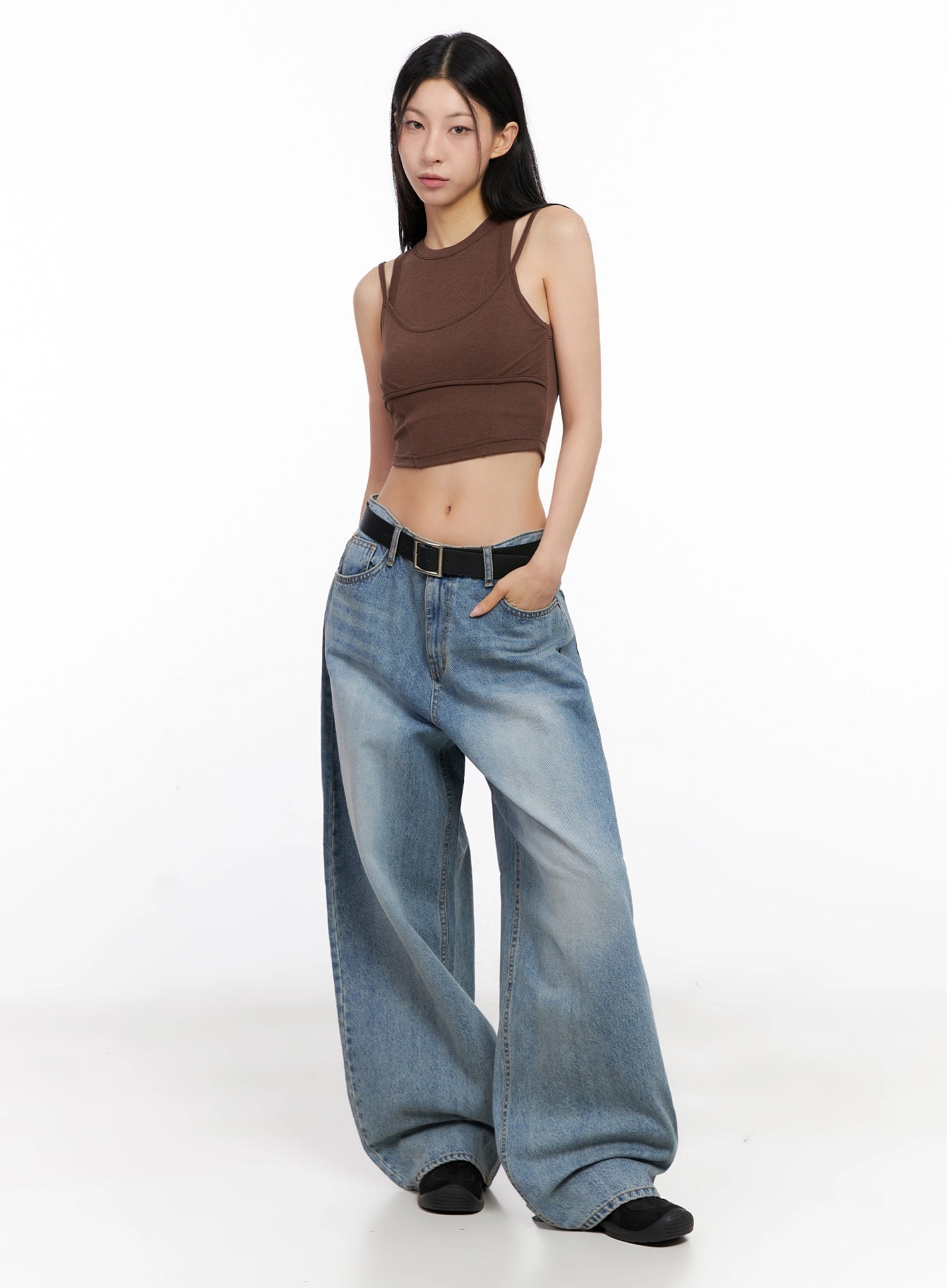 Seojin Washed Wide-Leg Jeans IG508 in blue, three-quarter front angle on model in brown crop top, hand in pocket, showing voluminous wide leg and washed gradient denim.