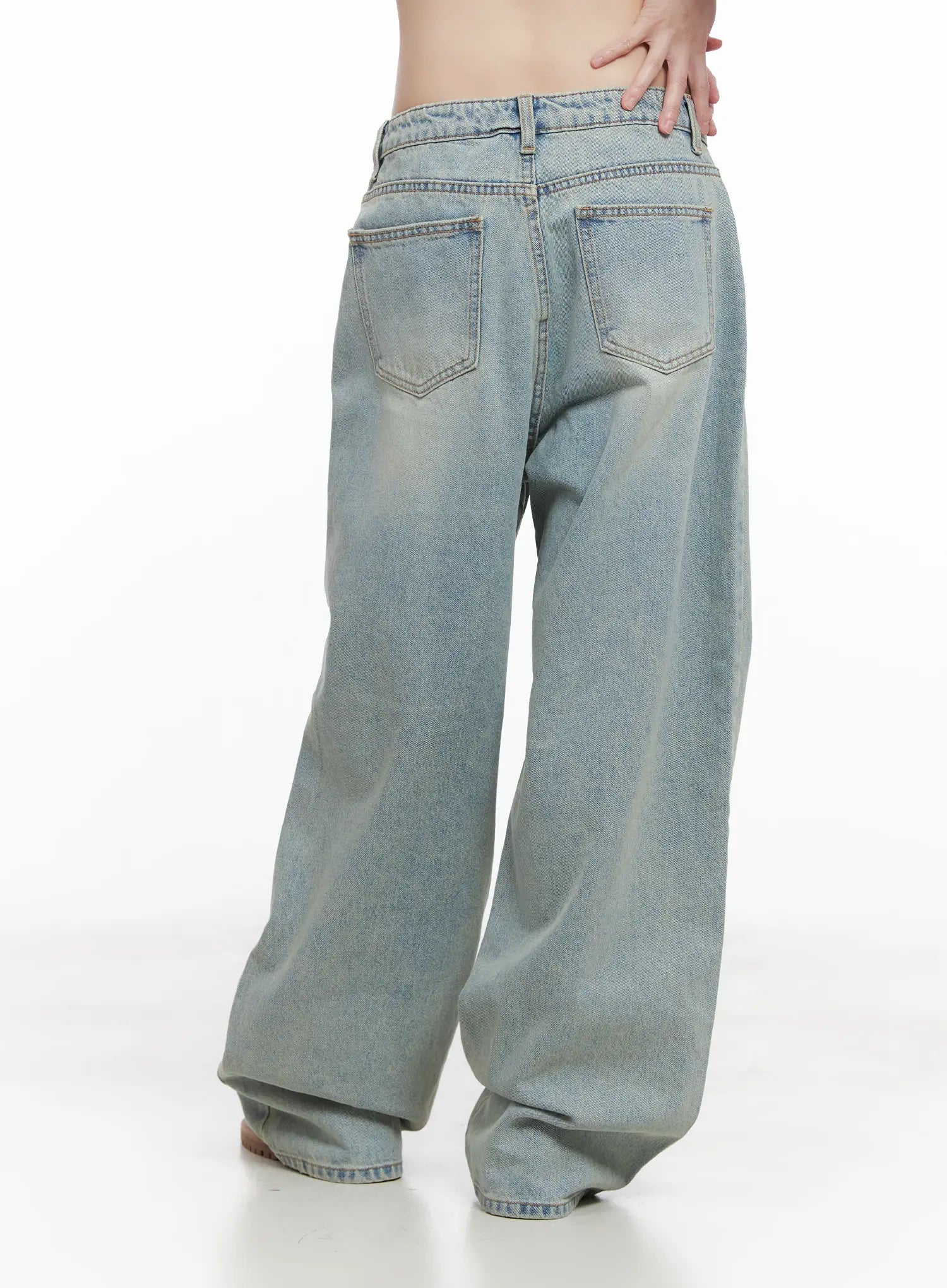 Lilly Light Wash Baggy Jeans CG519 in light blue, back close-up from waist to hem, dual back pockets with topstitching and faded wash detail on wide-leg cotton denim.