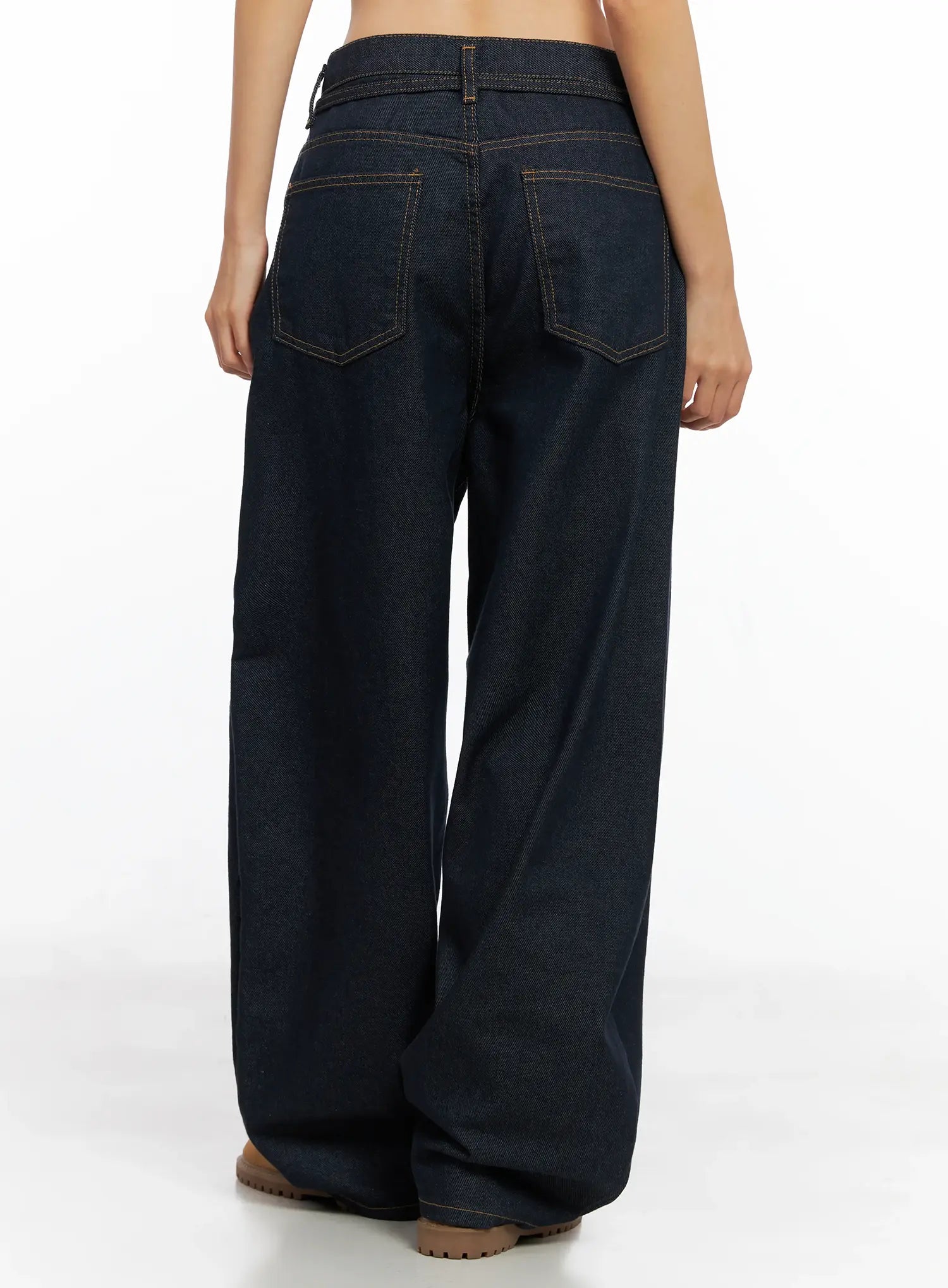 Alanna Sun Belt Baggy Jeans CO528 in dark indigo, back view on model, wide-leg cotton denim with two back patch pockets and contrast topstitching, full-length silhouette.