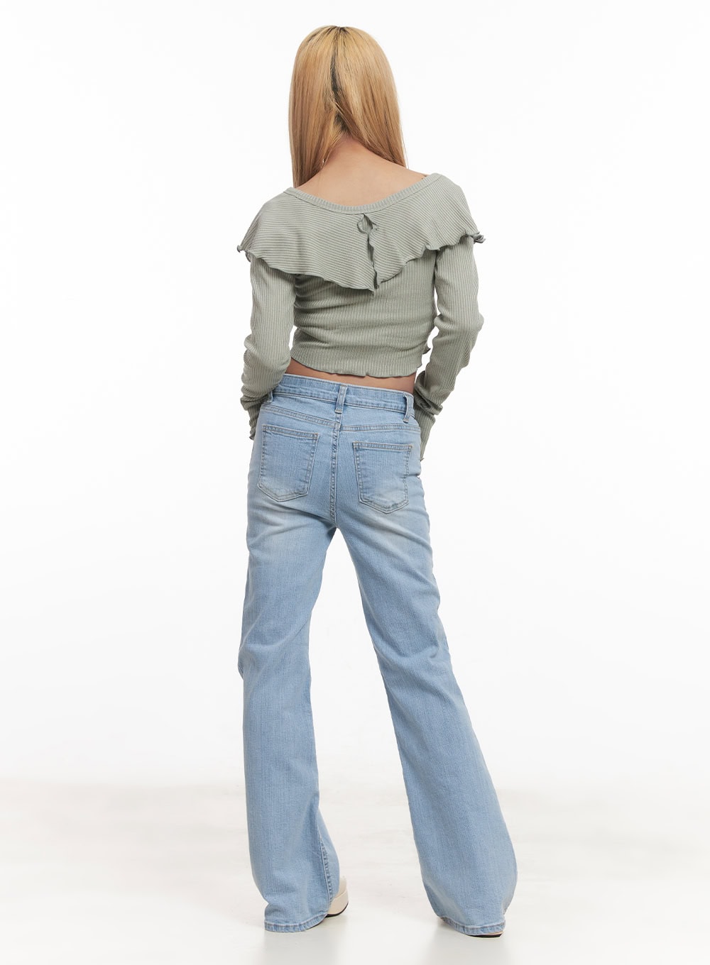 Suzy Slim-Fit Bootcut Jeans CM505 in light blue, back full-body shot on model, rear pockets and bootcut flare hem visible, washed denim, styled with sage ruffle crop top.
