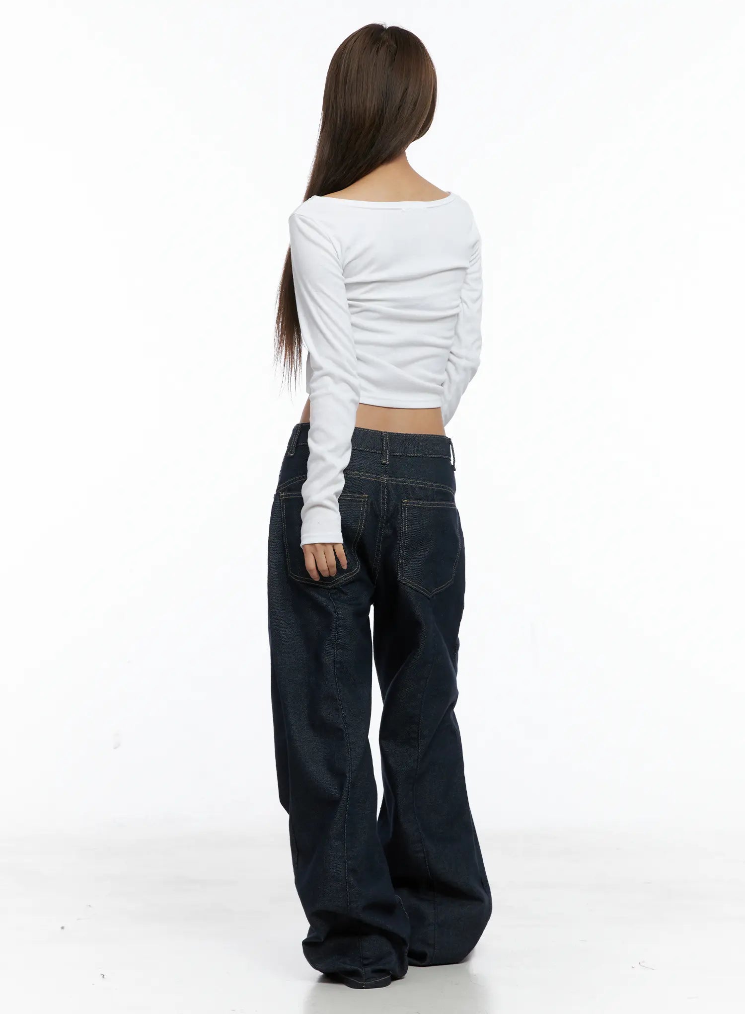 Giada Raw Indigo Wide-Leg Jeans CS505 in dark blue, back full-body shot on model, back pockets and waistband detail visible, floor-length wide-leg hem, styled with white crop top.