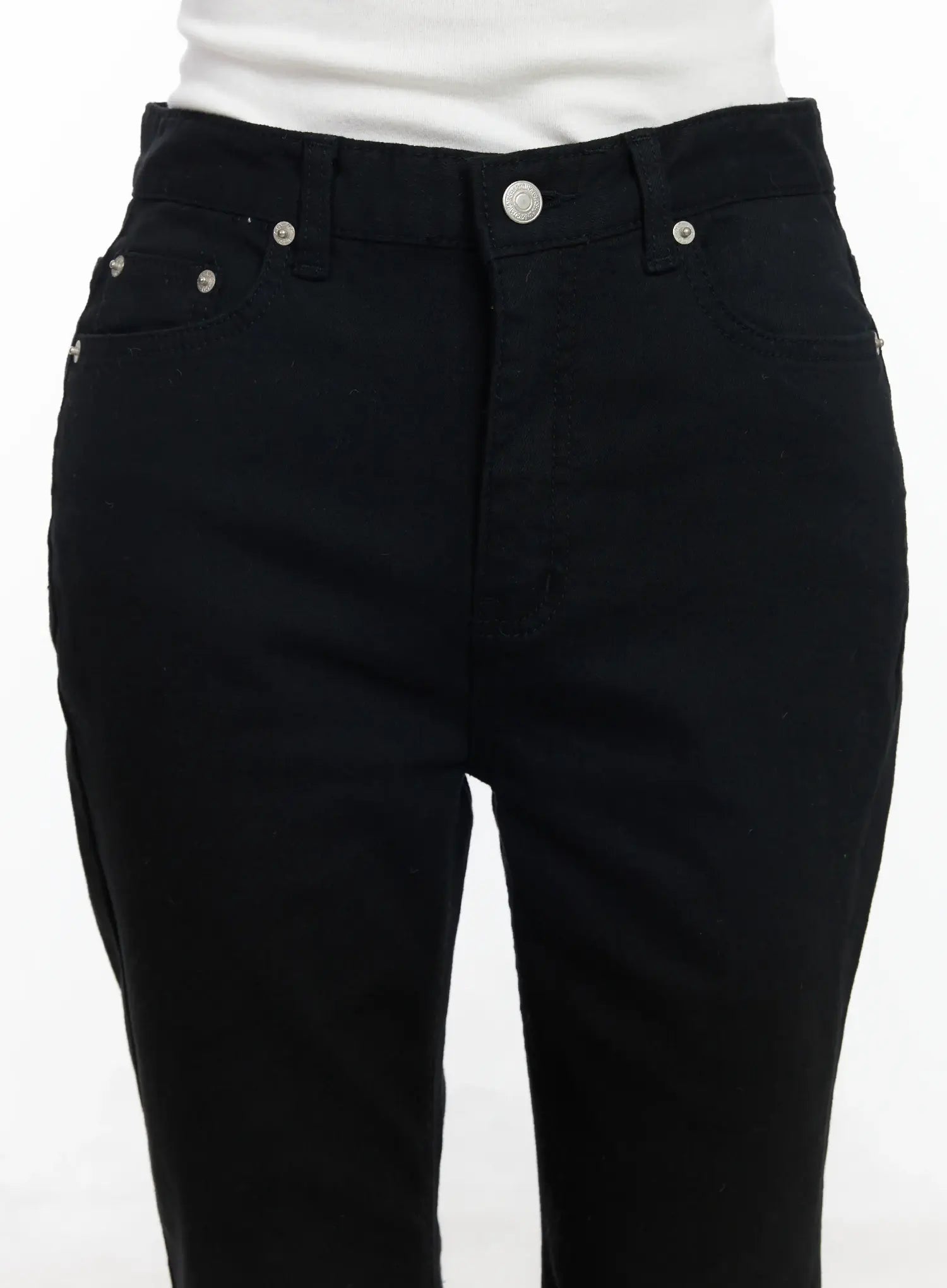 Ellis High-Waist Bootcut Jeans IJ529 in black, close-up front detail of waistband on model, showing silver button closure, rivet-accented front pockets, and high-rise cotton-spandex fabric.