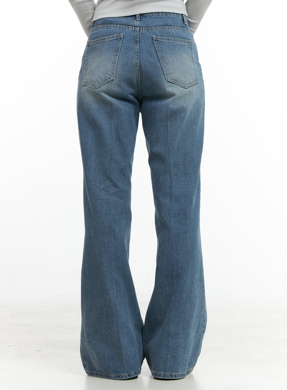 Daisy Loose Fit Bootcut Jeans CG419 in blue, straight-on back product shot on model, washed cotton denim with dual back pockets and subtle bootcut flare at hem.