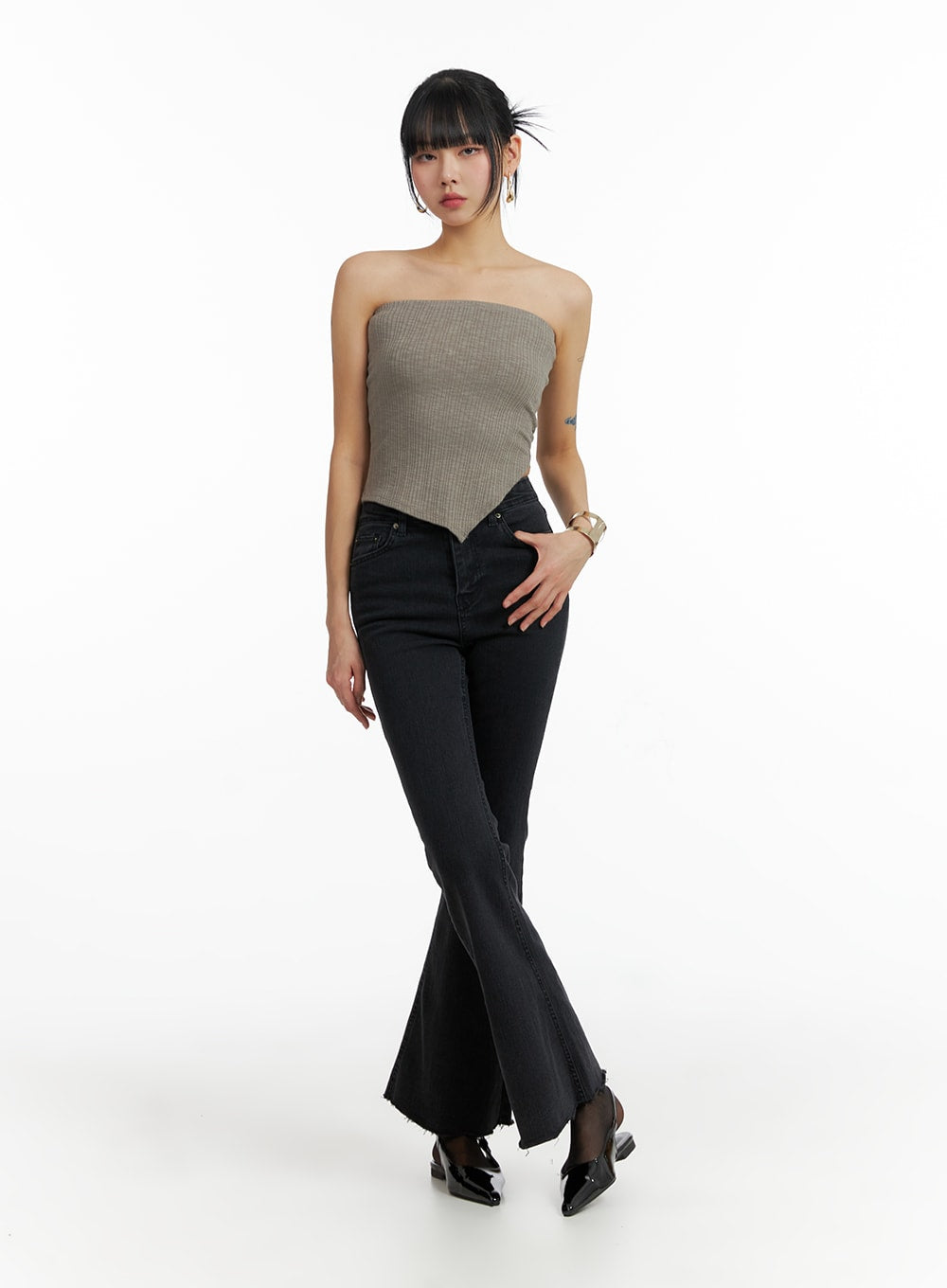 Mid Waist Button Flared Jeans IF402 in dark grey, front full-body editorial shot on model, mid-rise button fly, slim silhouette with dramatic flared hem, styled with mocha bandeau tube top and black slingback flats.
