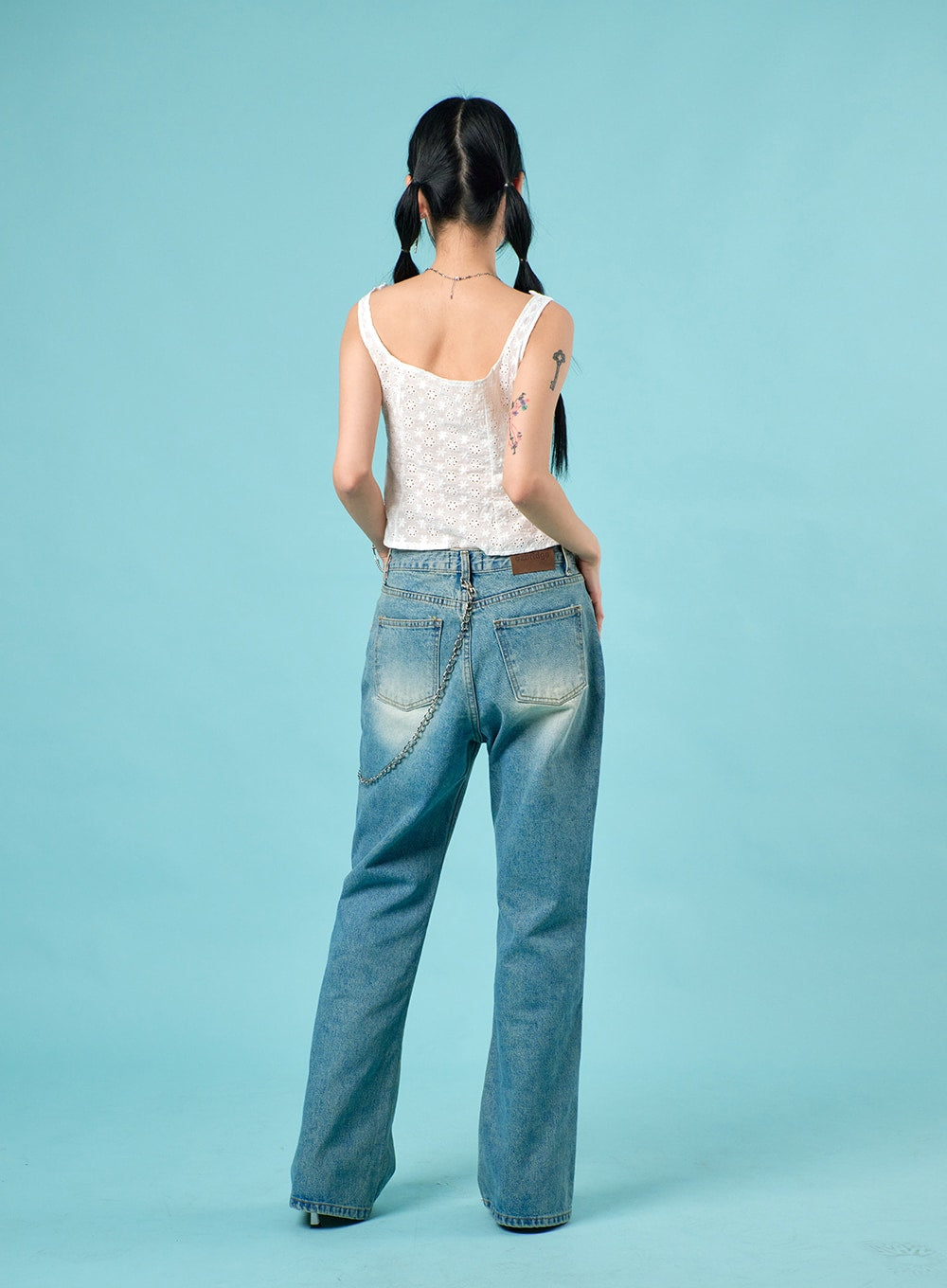 Washed Straight Leg Bootcuts Jeans IJ430 in light blue, back view on model, showing dual back pockets, leather patch, chain detail, and slight bootcut flare at hem.