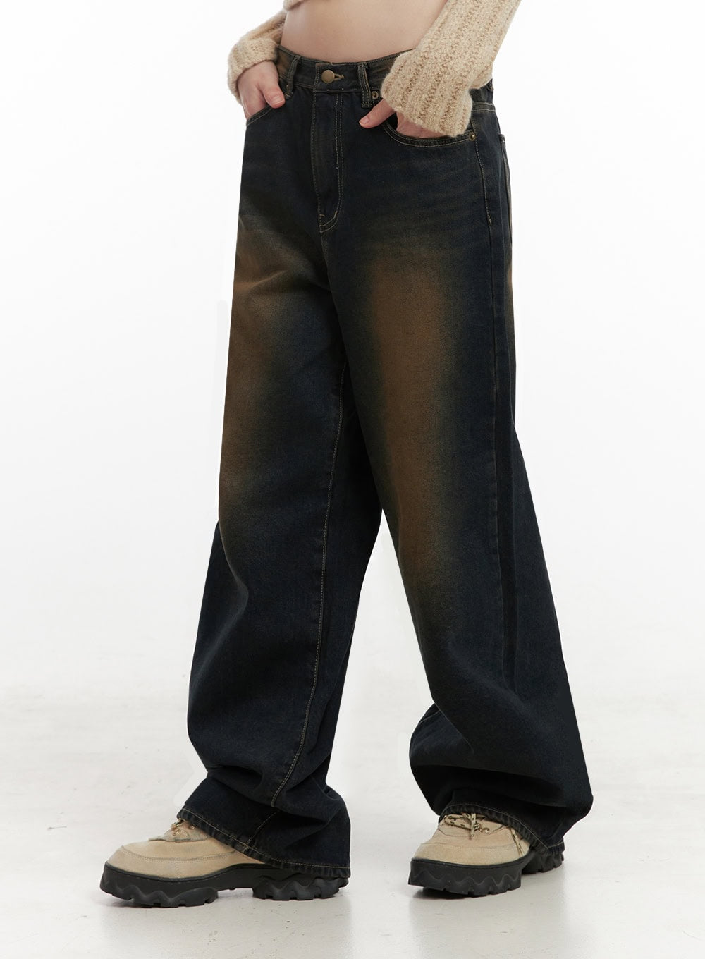 Alexia Washed Denim Wide-Leg Jeans ID402 in dark blue, side close-up on model, amber-washed cotton denim showing wide leg drape and contrast stitching, hand in pocket.