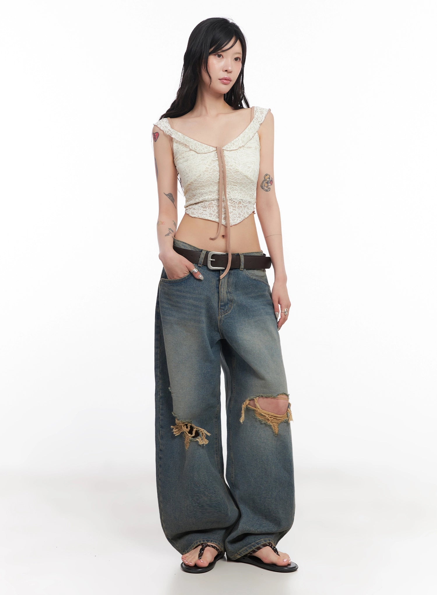 Jeemin Vintage Distressed Wide-Leg Denim Jeans IC503 in washed blue, slight three-quarter front angle on model, hand in pocket pose, wide ballooned leg pooling at hem, distressed rips visible.